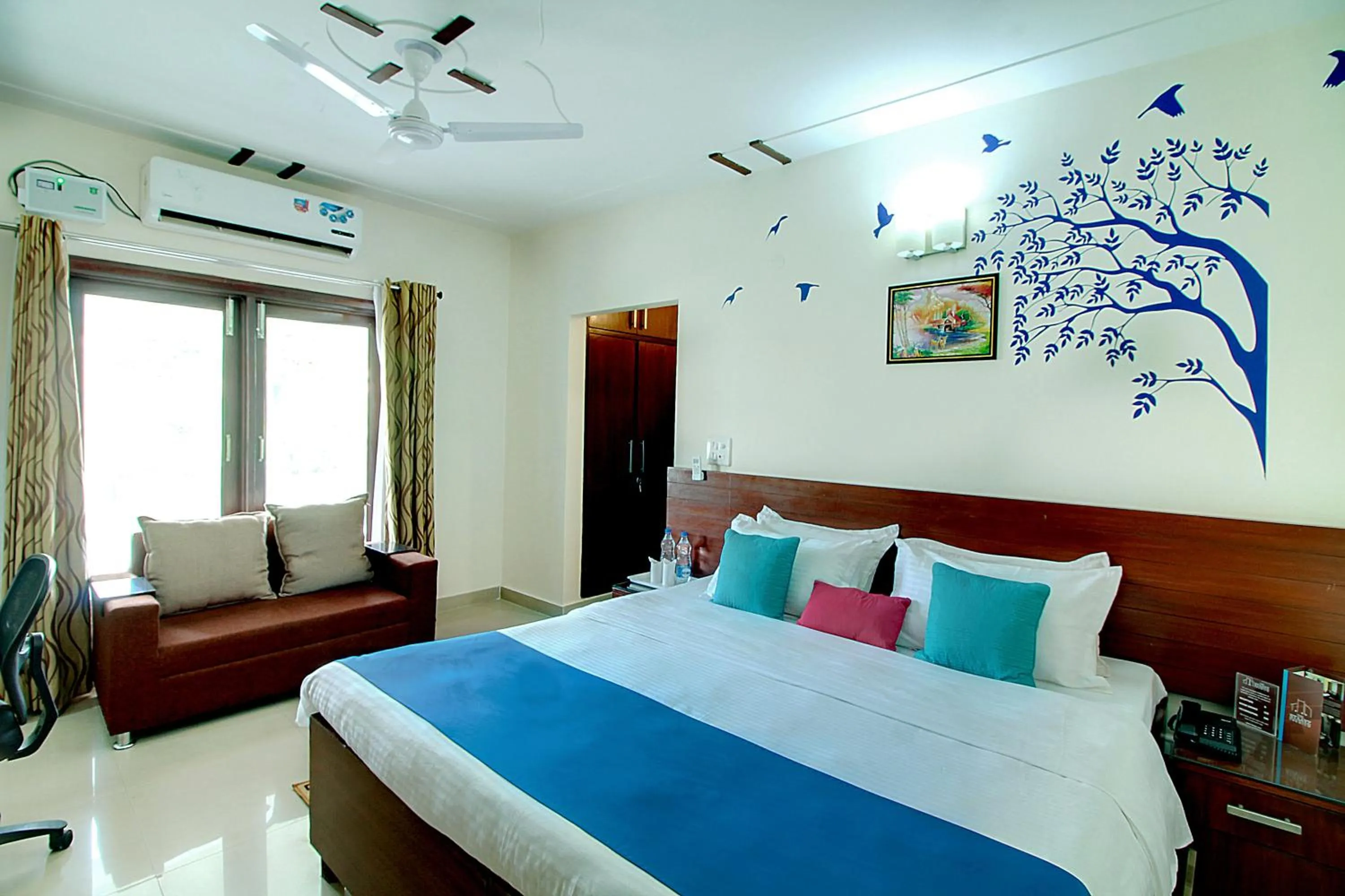 Seating area, Bed in STAAYZ Premium Gurgaon