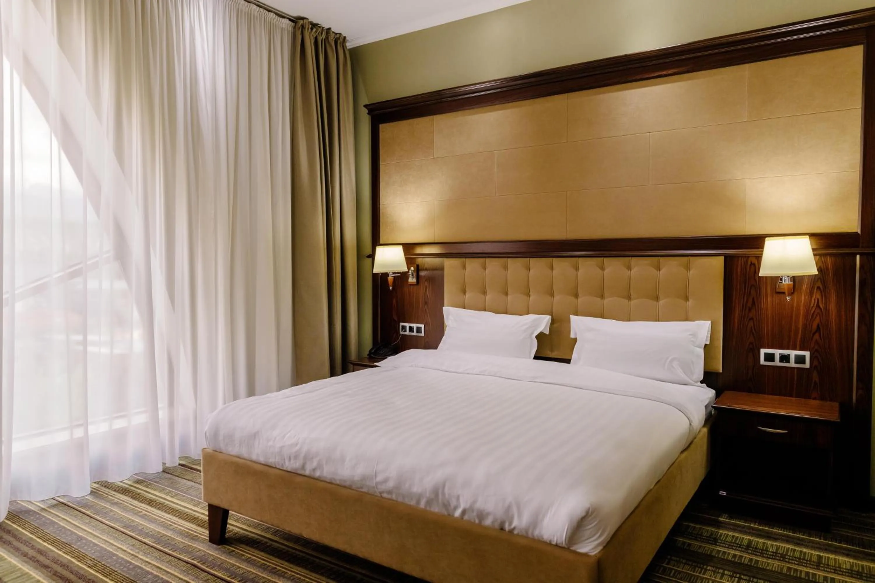 Bed in Shera Inn Hotel