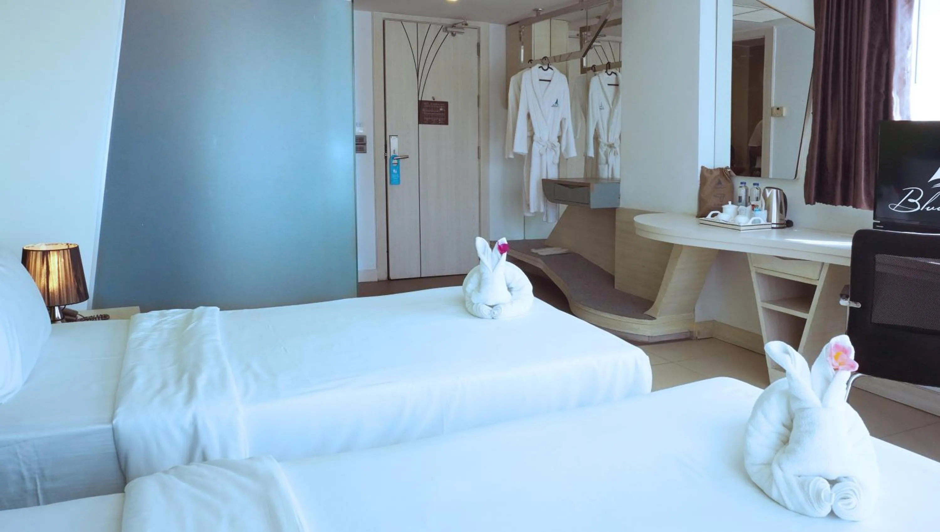 Bed in Blue Boat Hotel JC