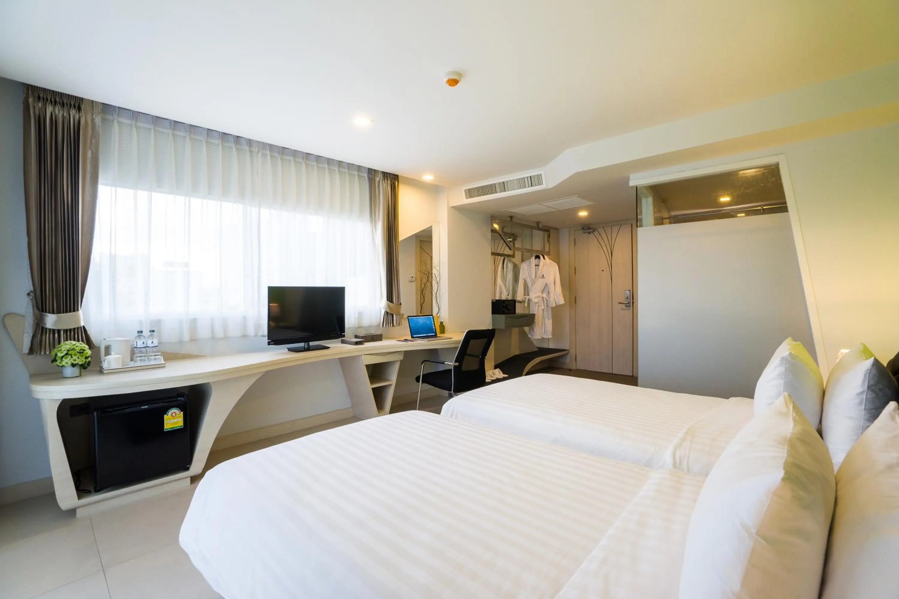 Bed in Blue Boat Hotel JC