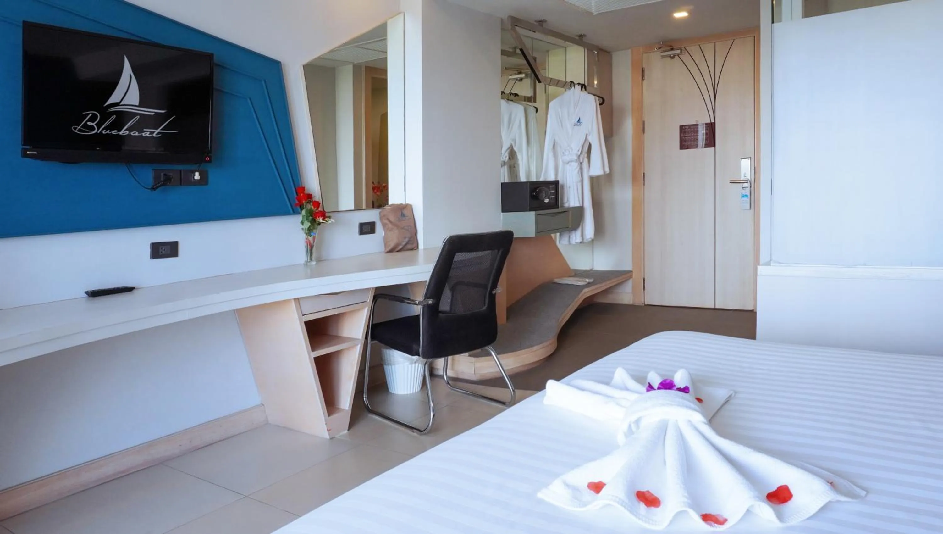 Bed in Blue Boat Hotel JC