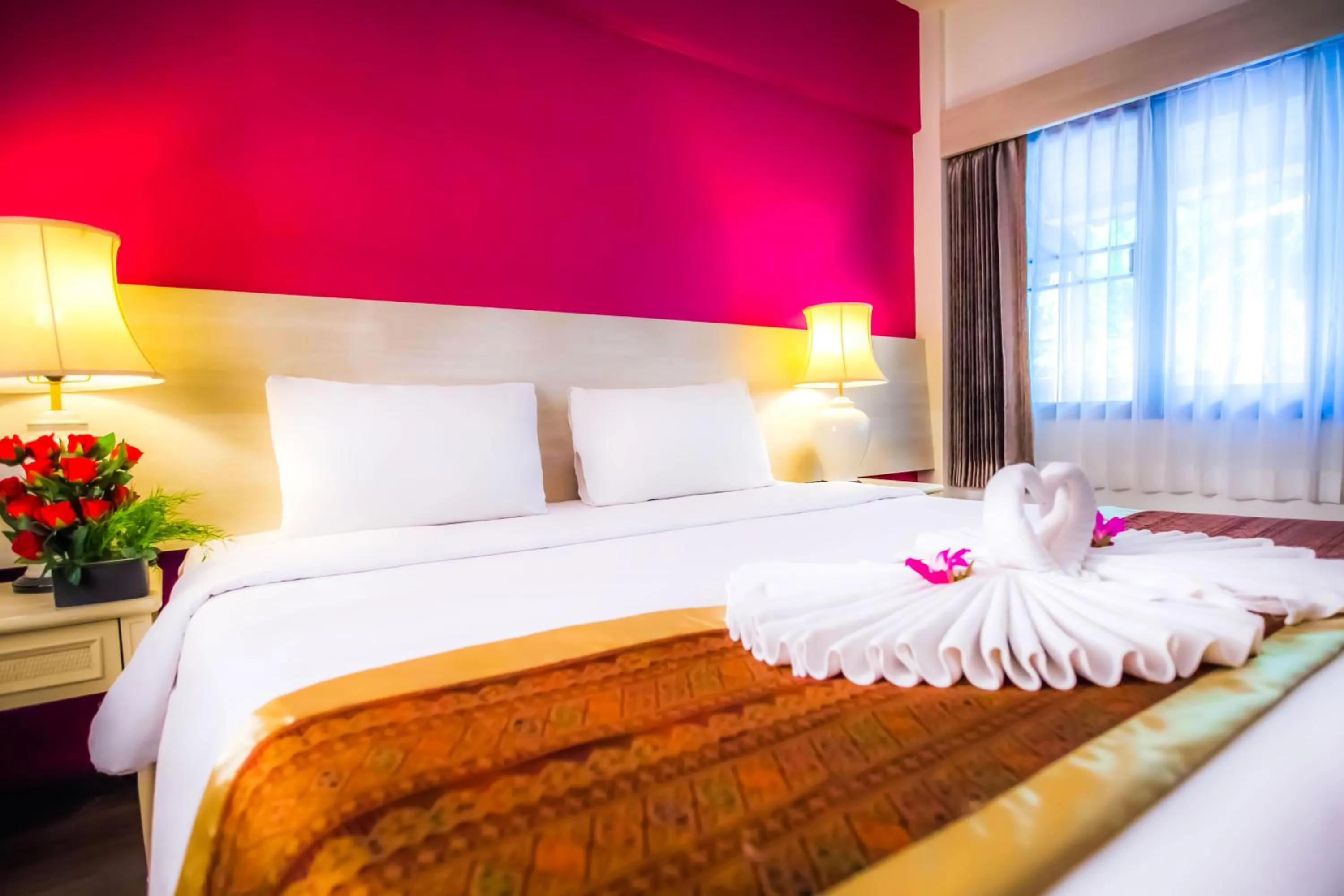 Bed in Natural Park Resort Pattaya