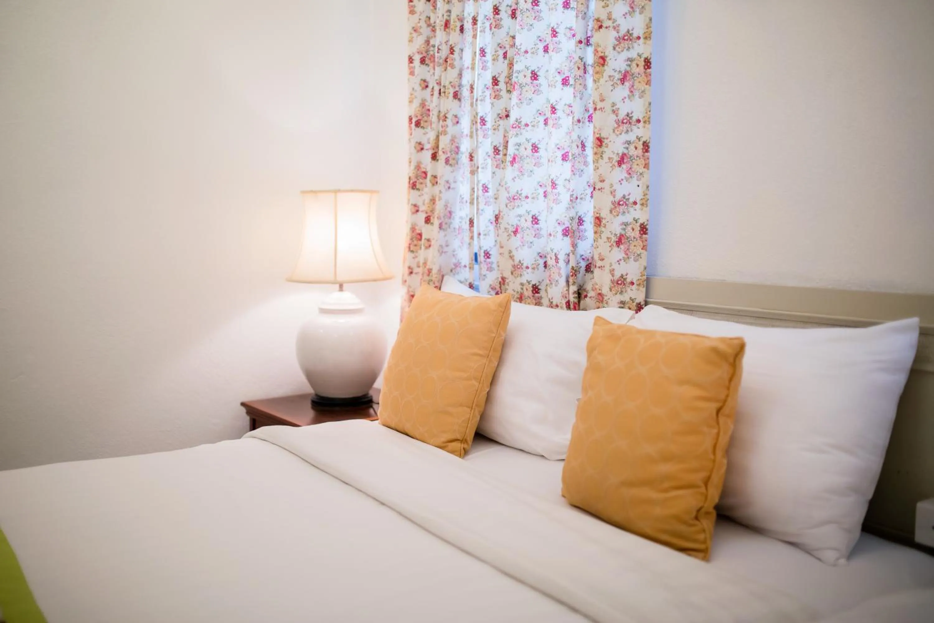 Bed in Natural Park Resort Pattaya