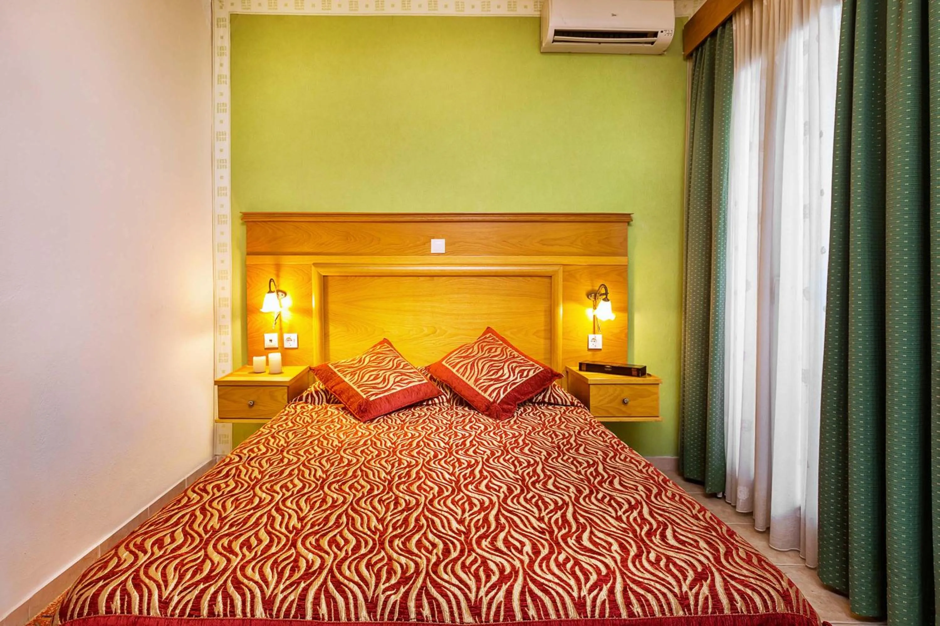 Bed in Akritas Ef Zin Villas & Suites