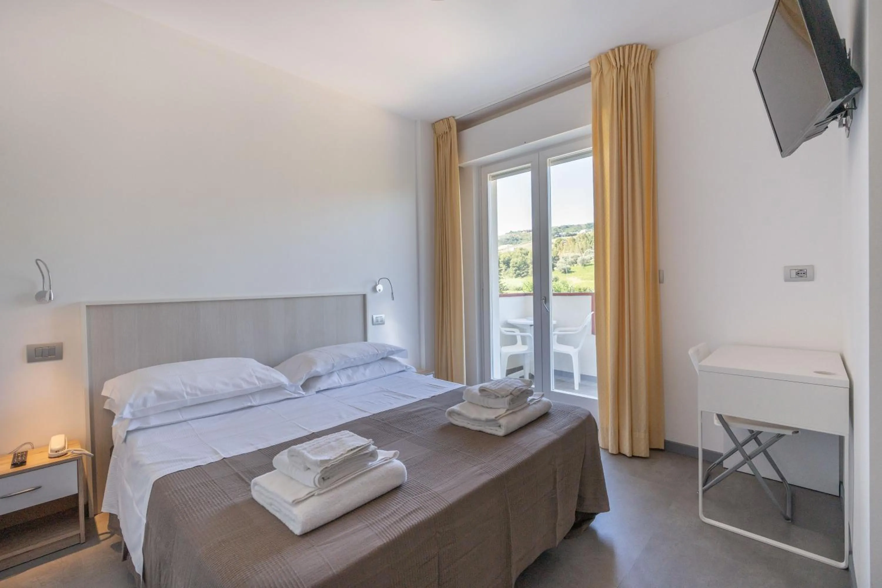 Bed in Pineto Resort