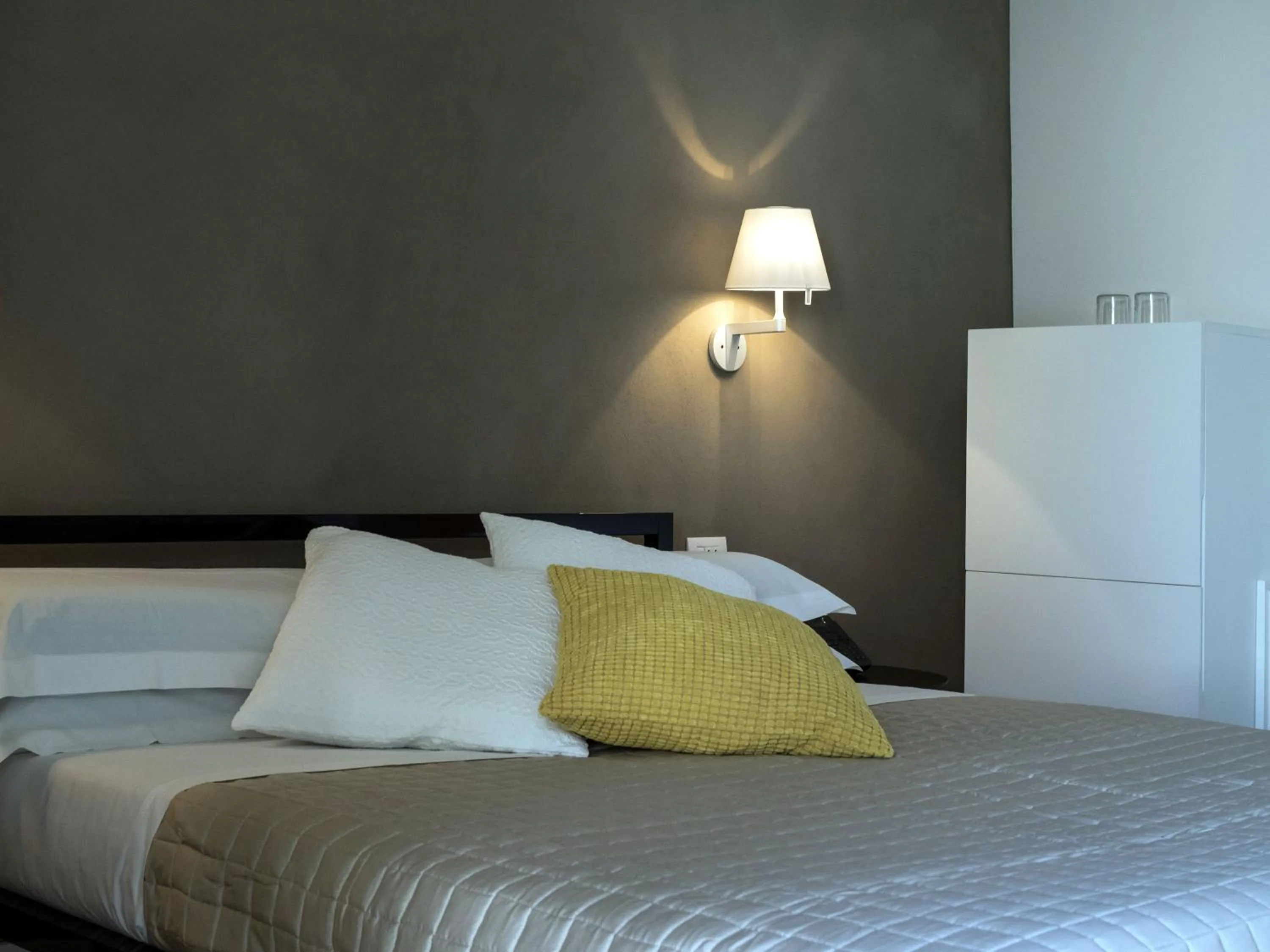 Bed in Talè Restaurant & Suite