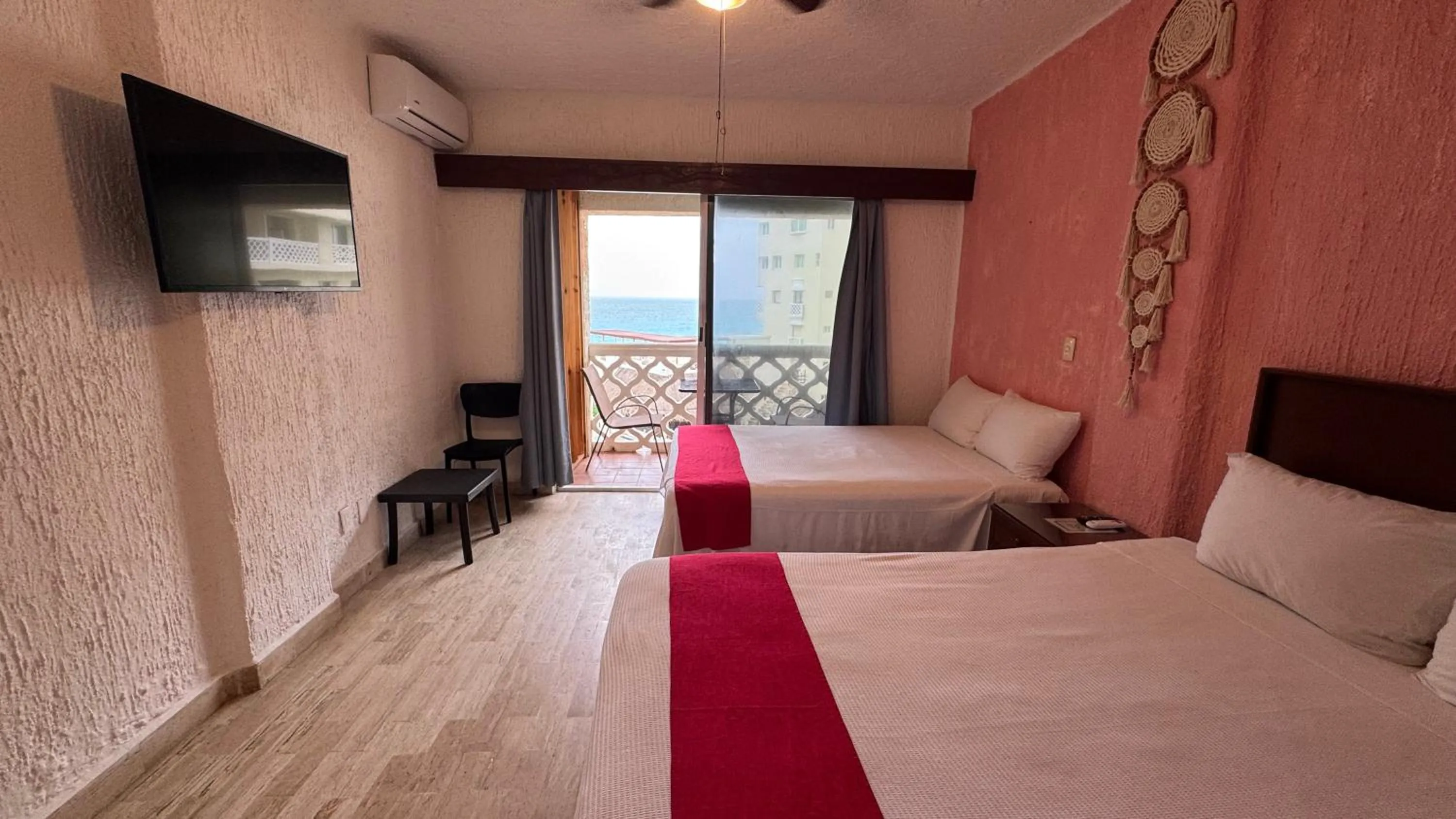 Bed in Cancún Plaza Sea View