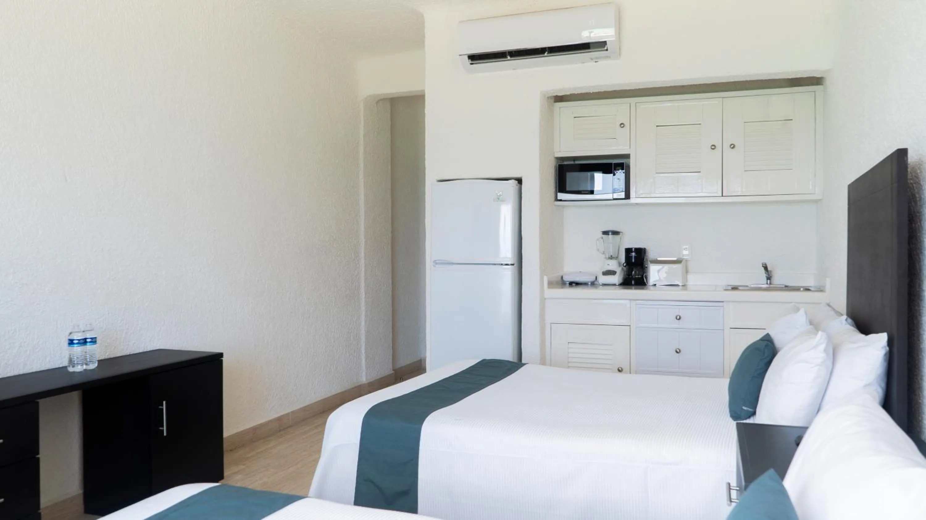 Bed in Cancún Plaza Sea View