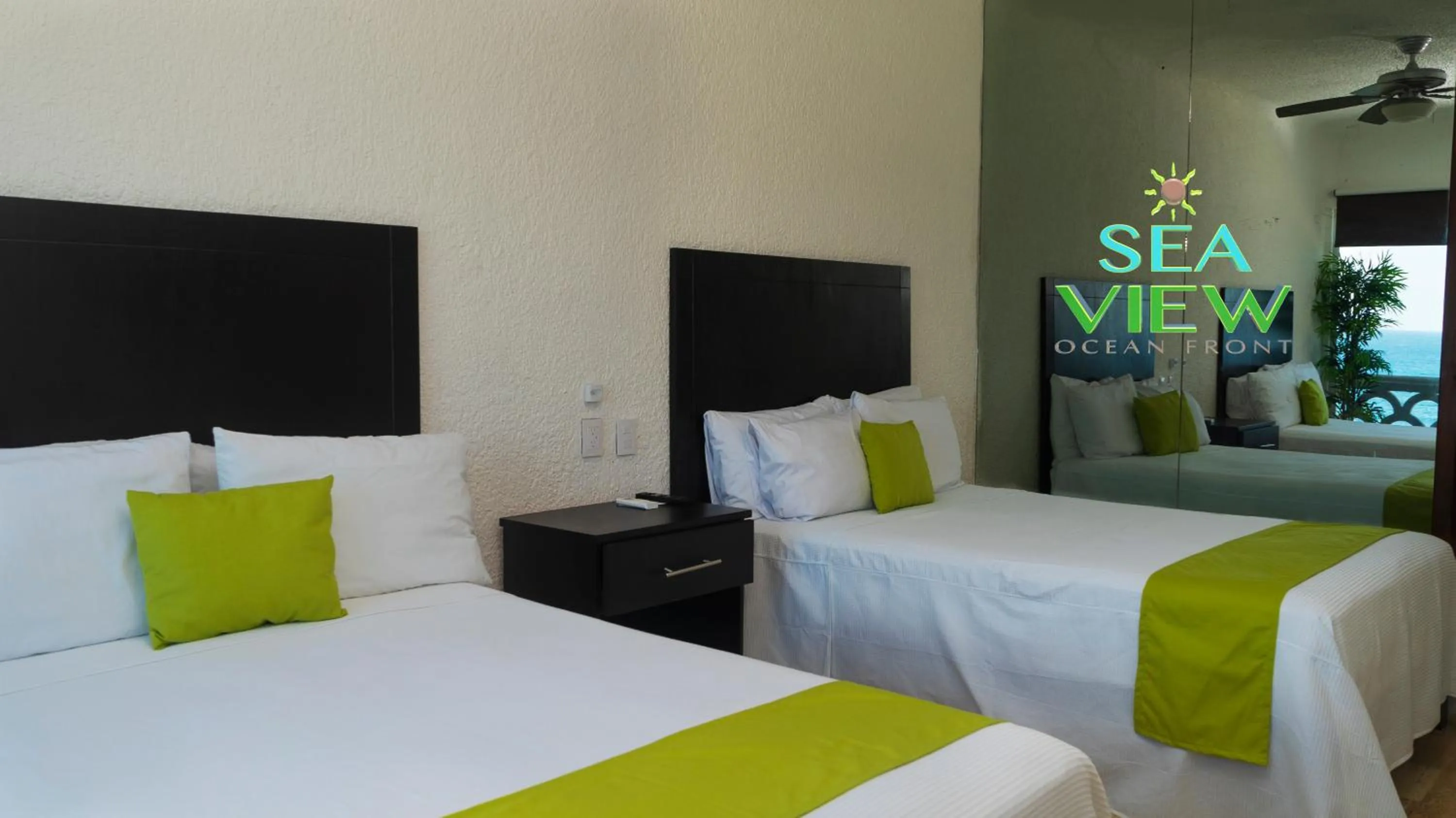 Bed in Cancún Plaza Sea View