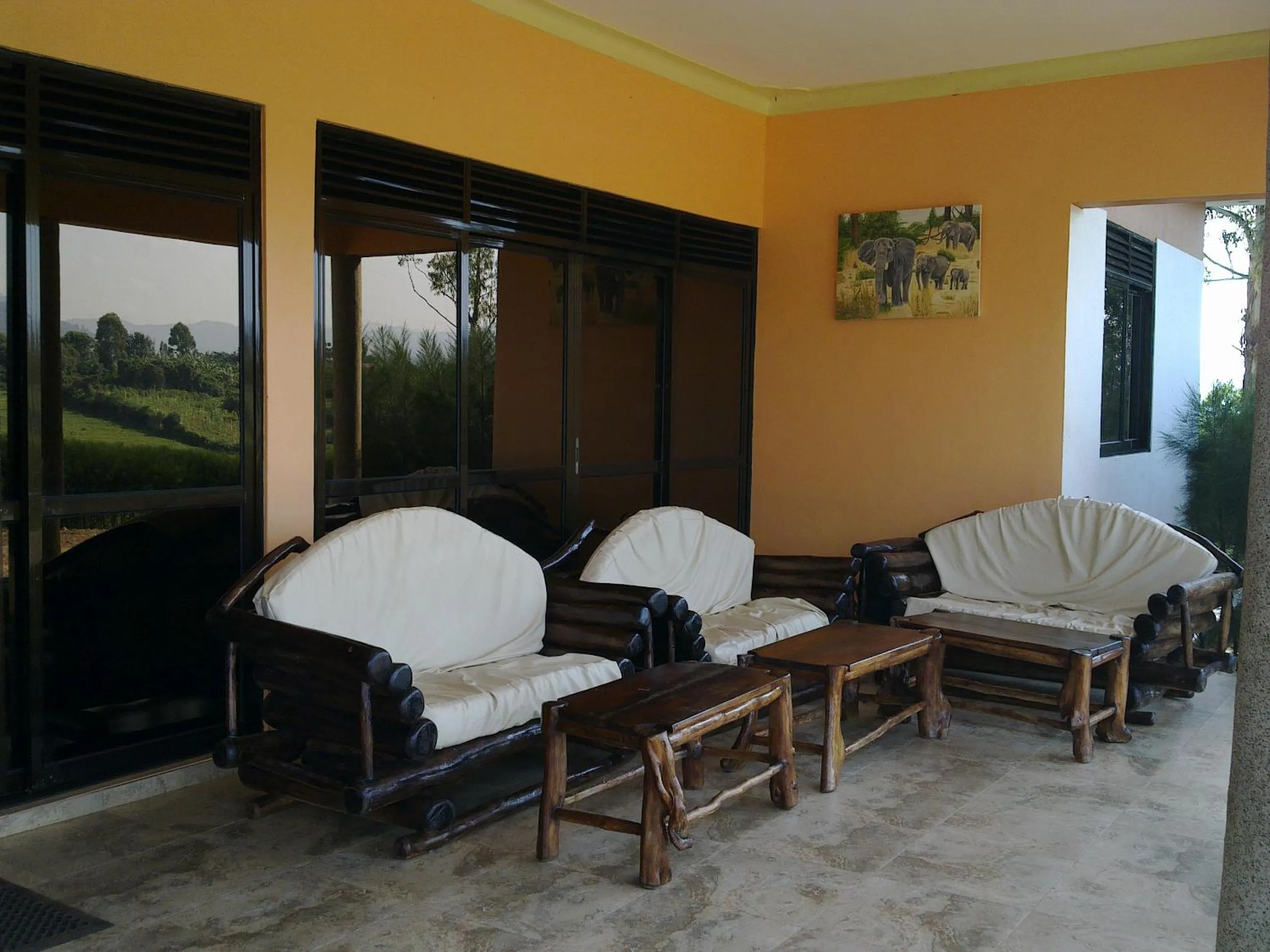 Communal lounge/ TV room in The Crested Crane Bwindi Hotel