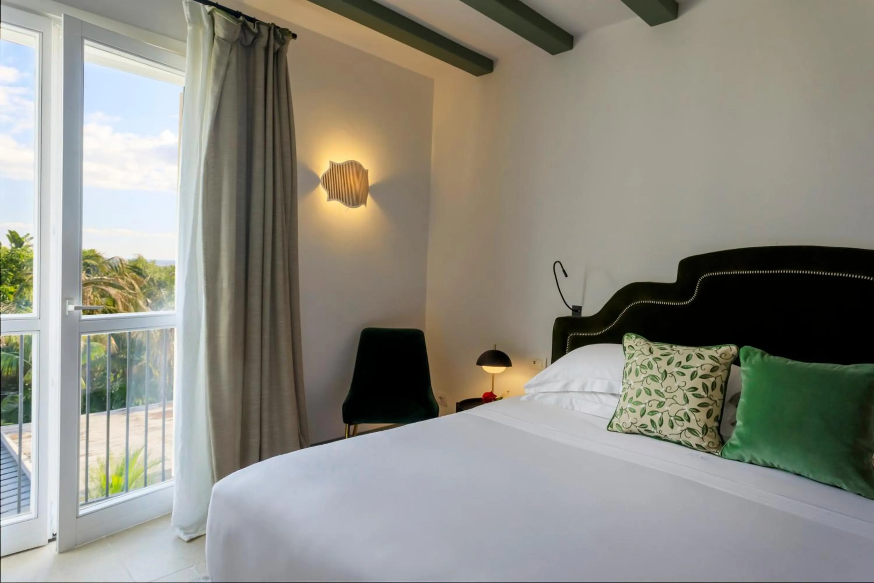 Bed in Donna Carmela Resort & Lodges