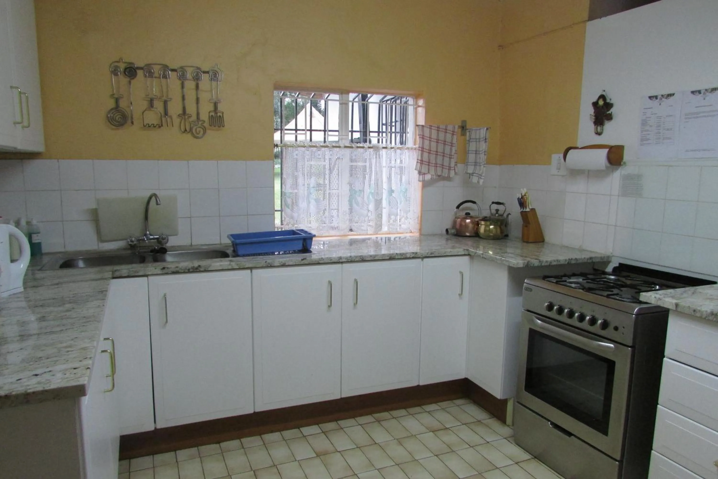 Kitchen or kitchenette in Absolute Leisure Cottages