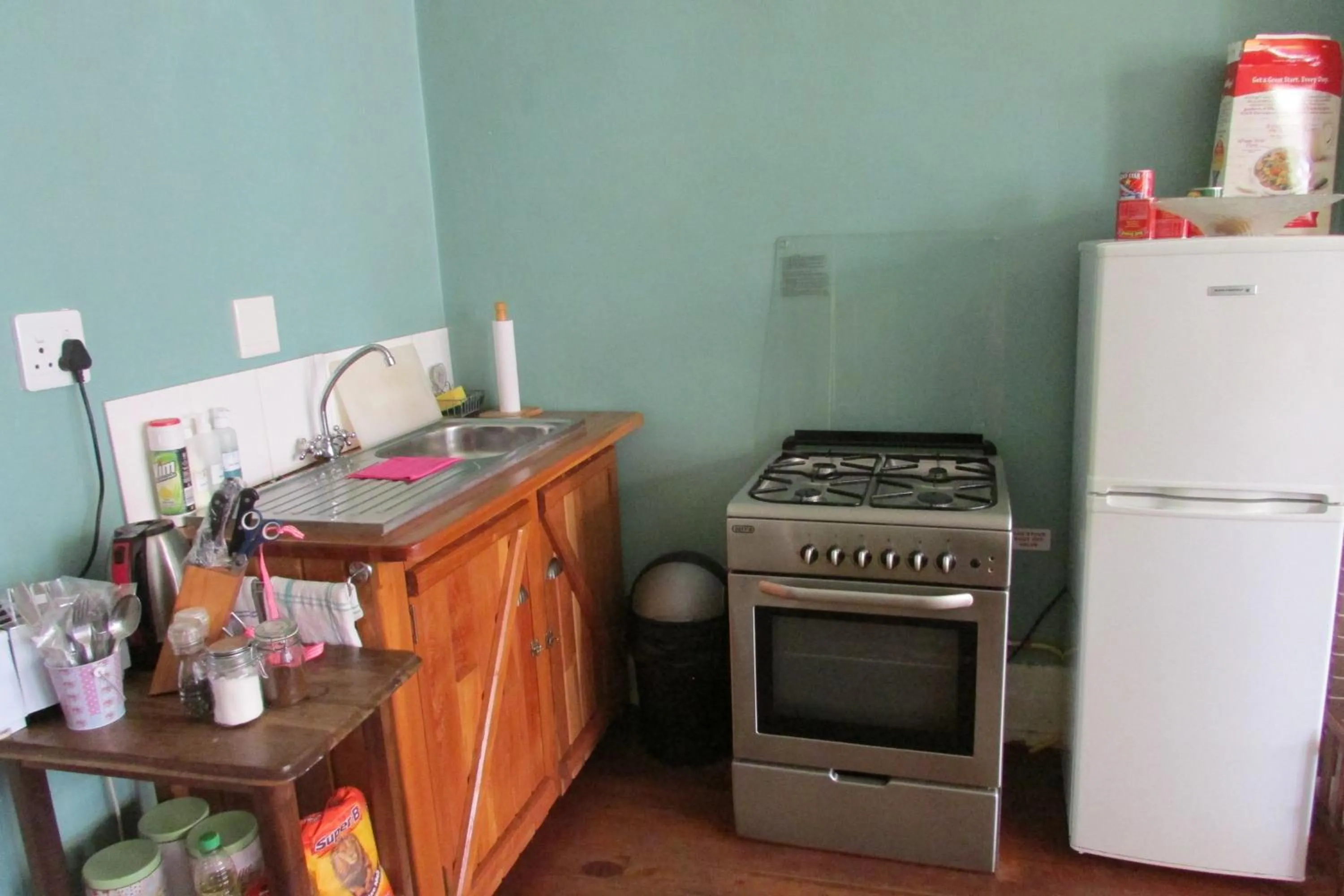 Kitchen or kitchenette in Absolute Leisure Cottages
