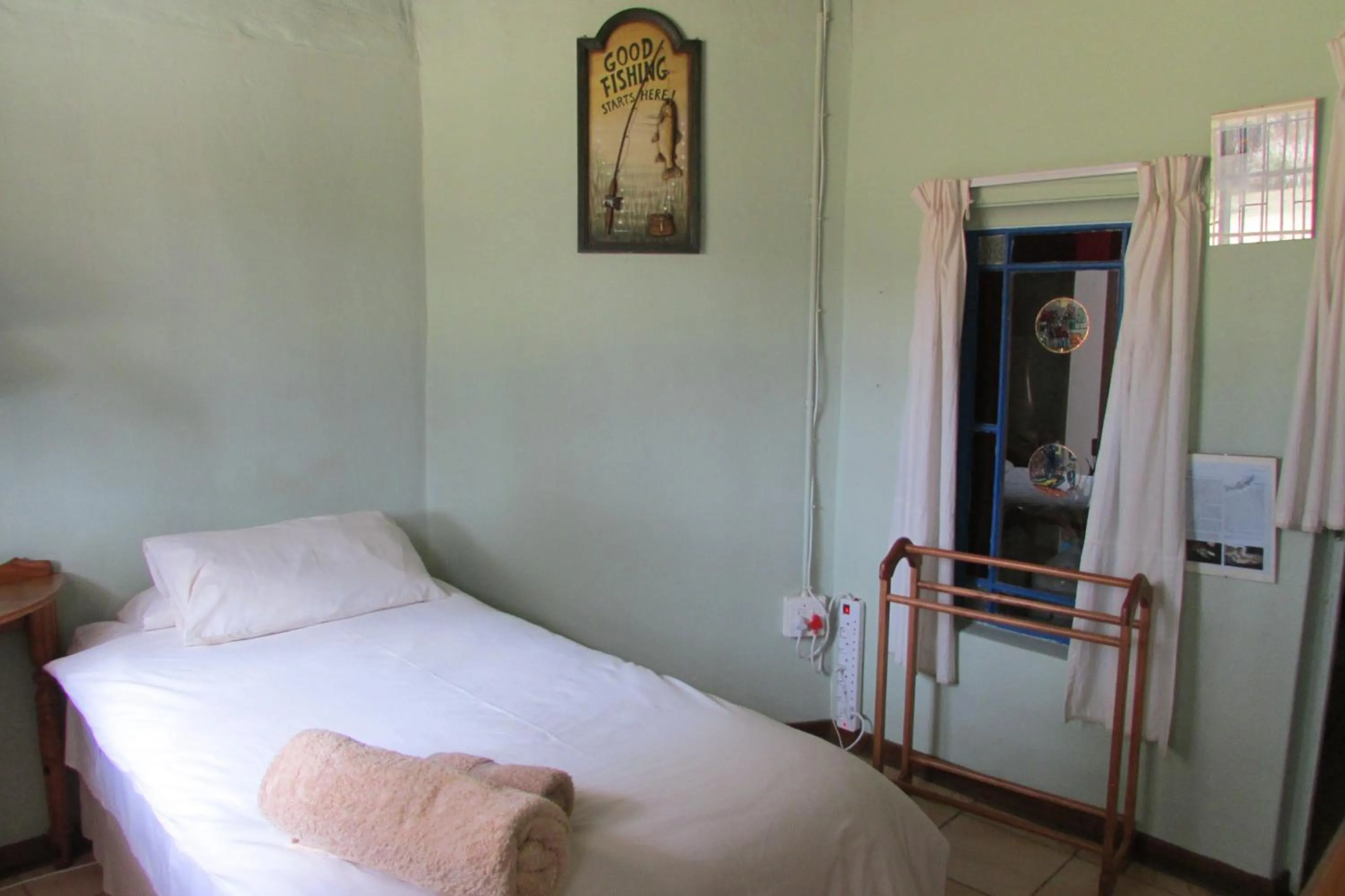 Bed in Absolute Leisure Cottages