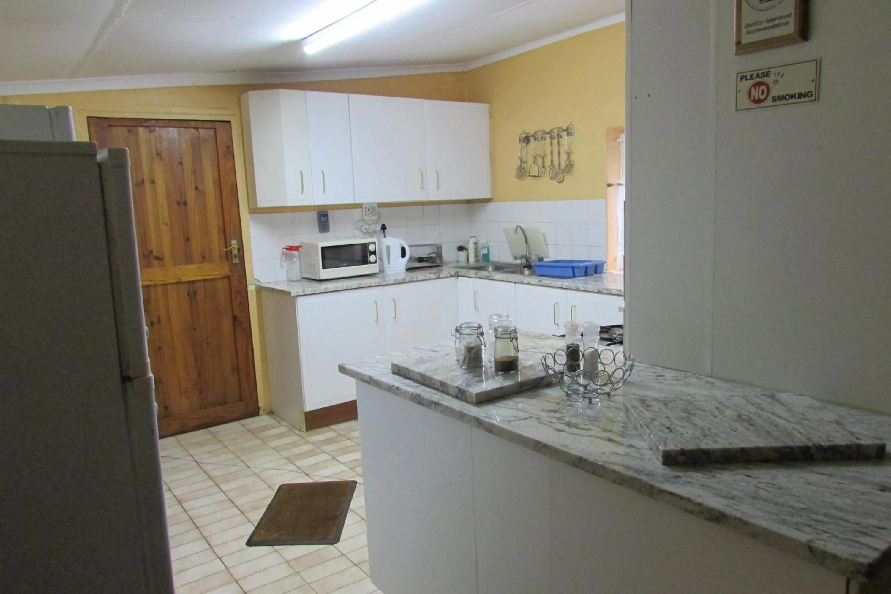 Kitchen or kitchenette in Absolute Leisure Cottages