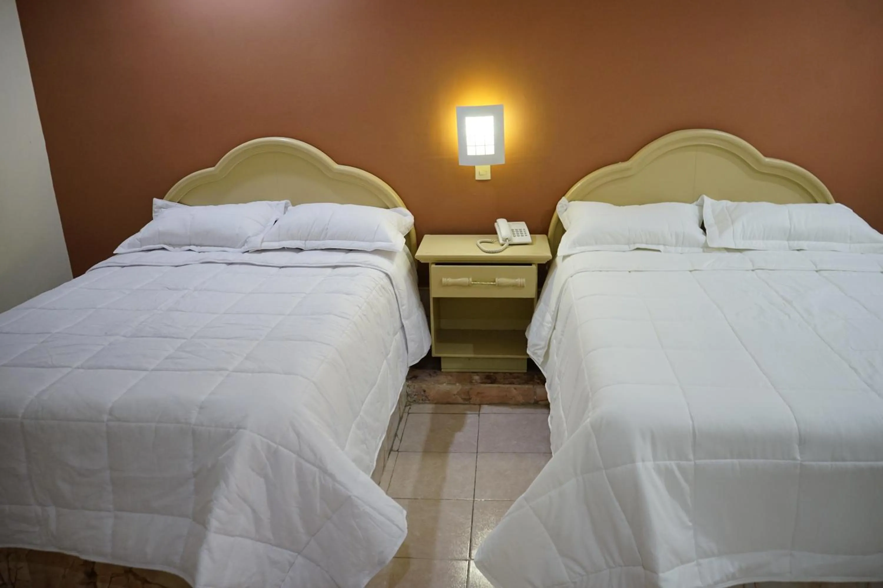 Bed in Hotel Posada del Sol Inn