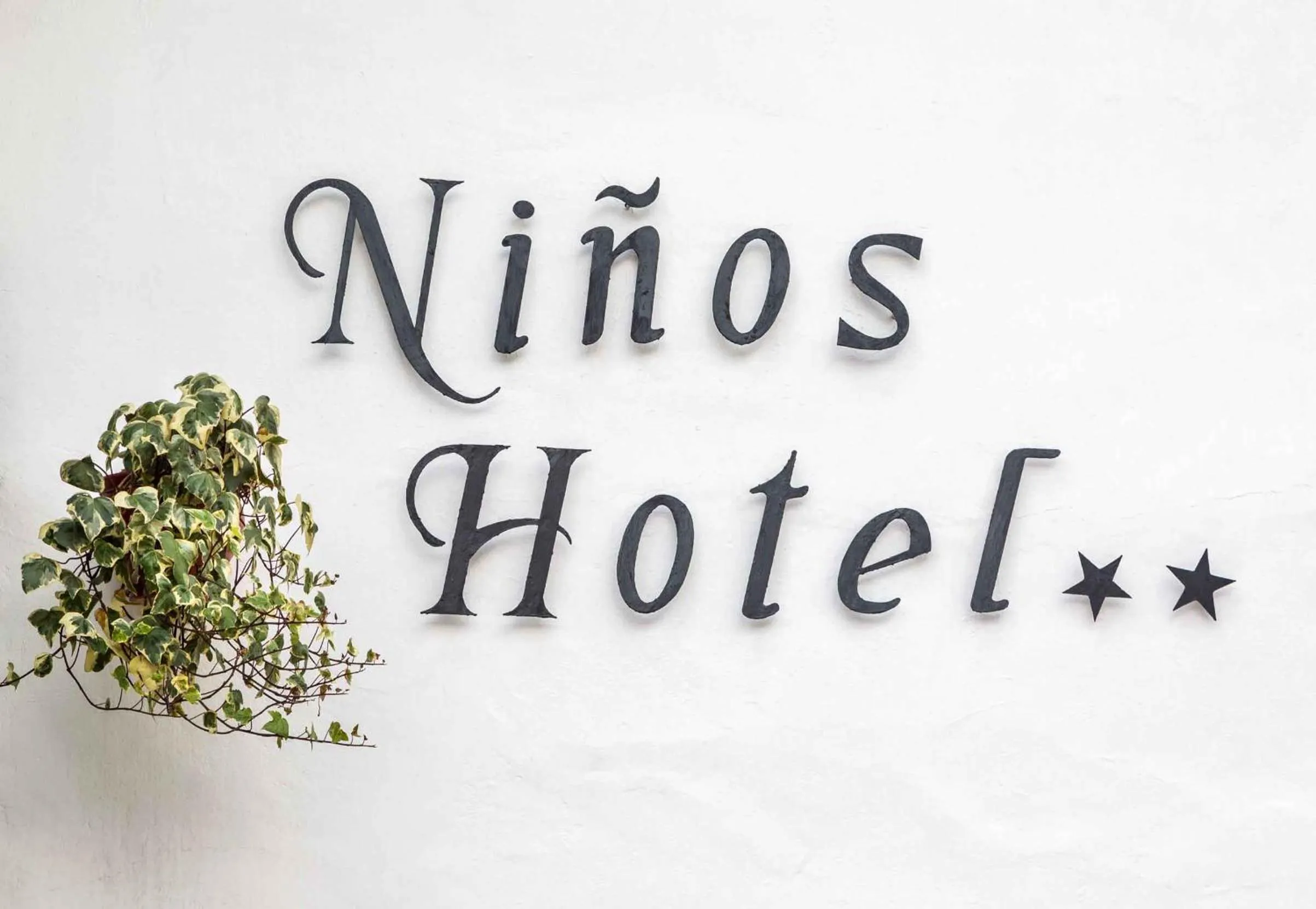 Property logo or sign in Niños Hotel Meloc