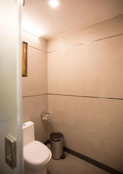 Toilet in Dunhill Beach Resort