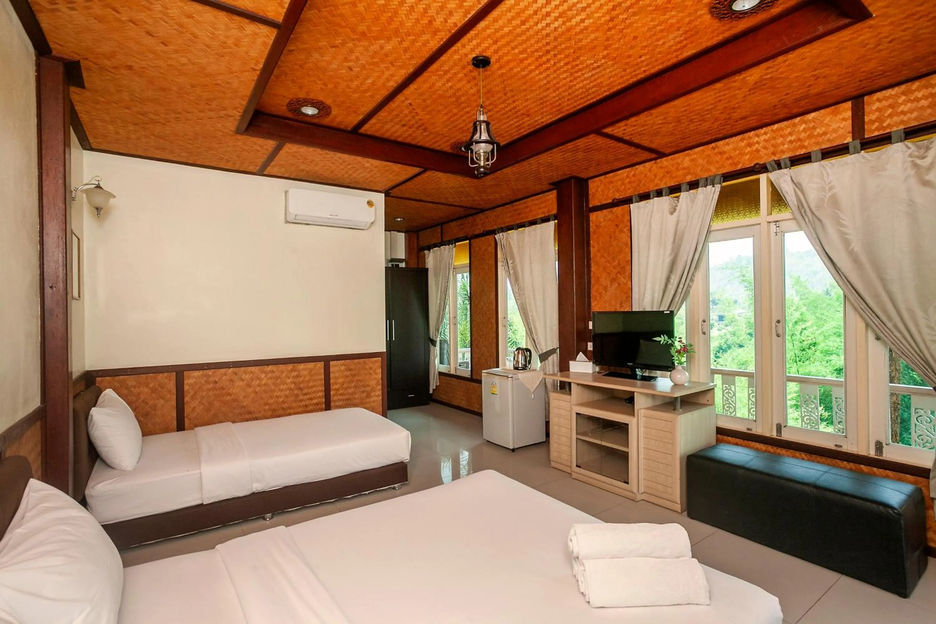 Bed in Baanpufa Resort