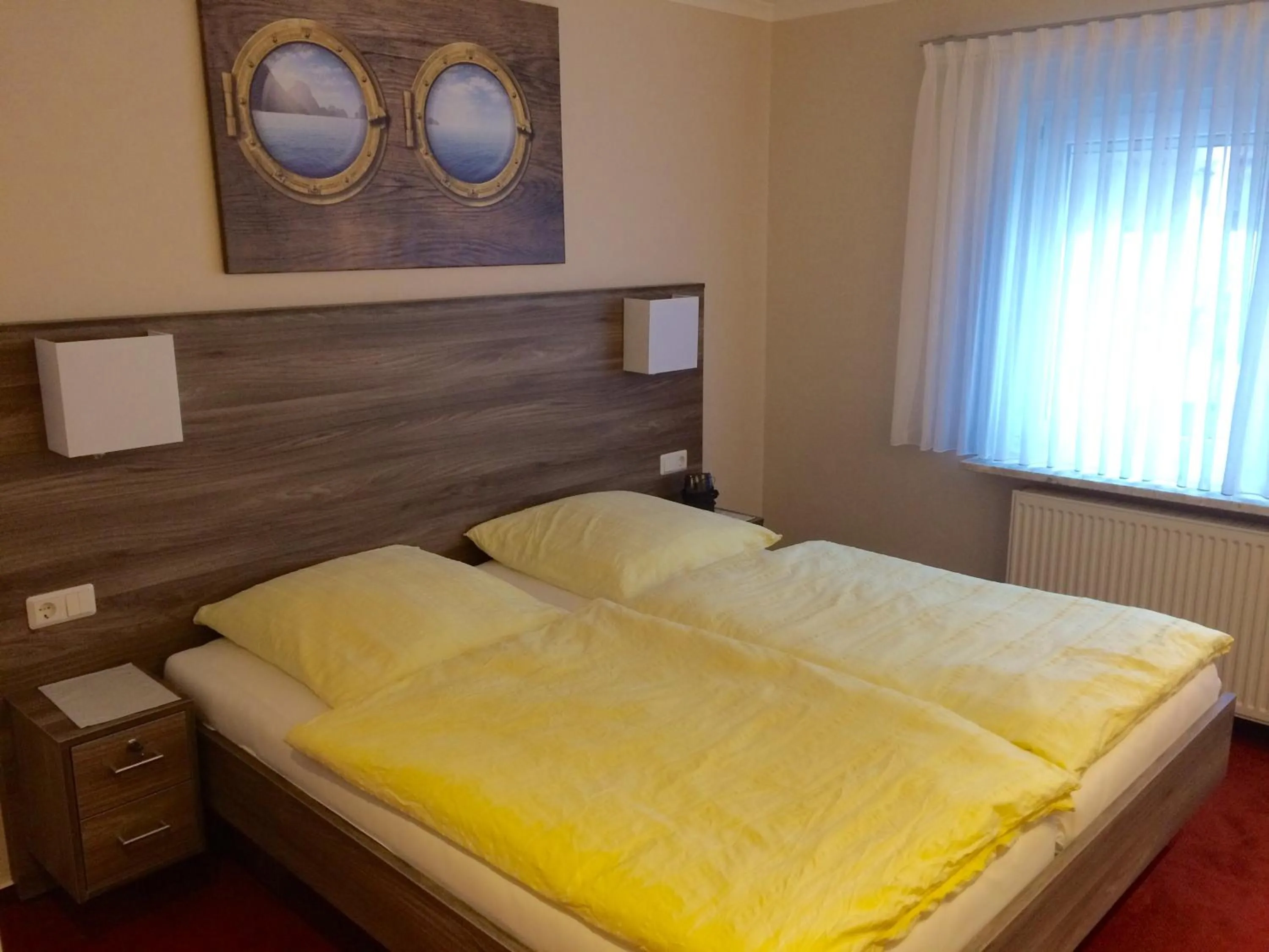 Photo of the whole room, Bed in Gästehaus Janßen