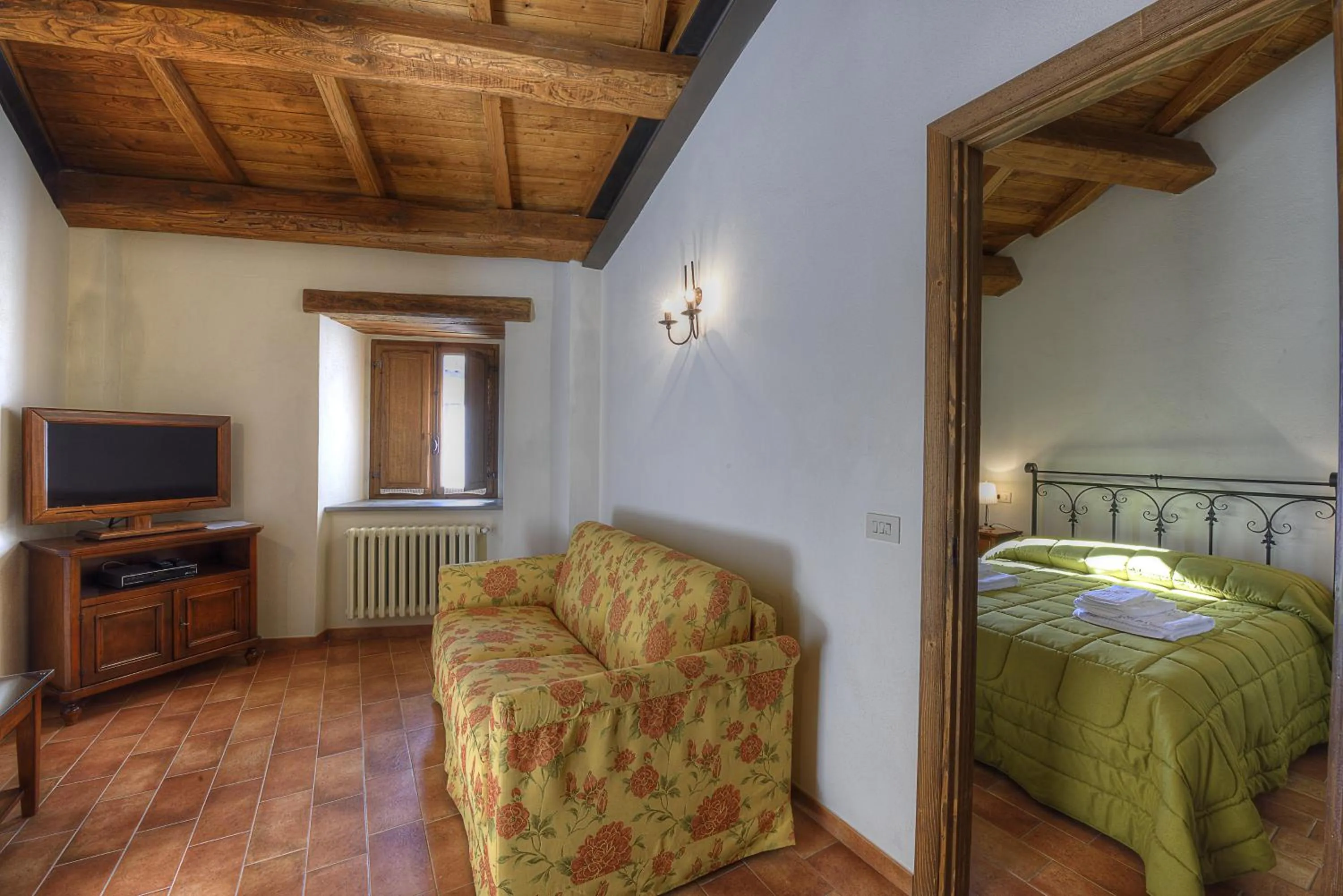 Living room, Bed in Borgotufi Albergo Diffuso