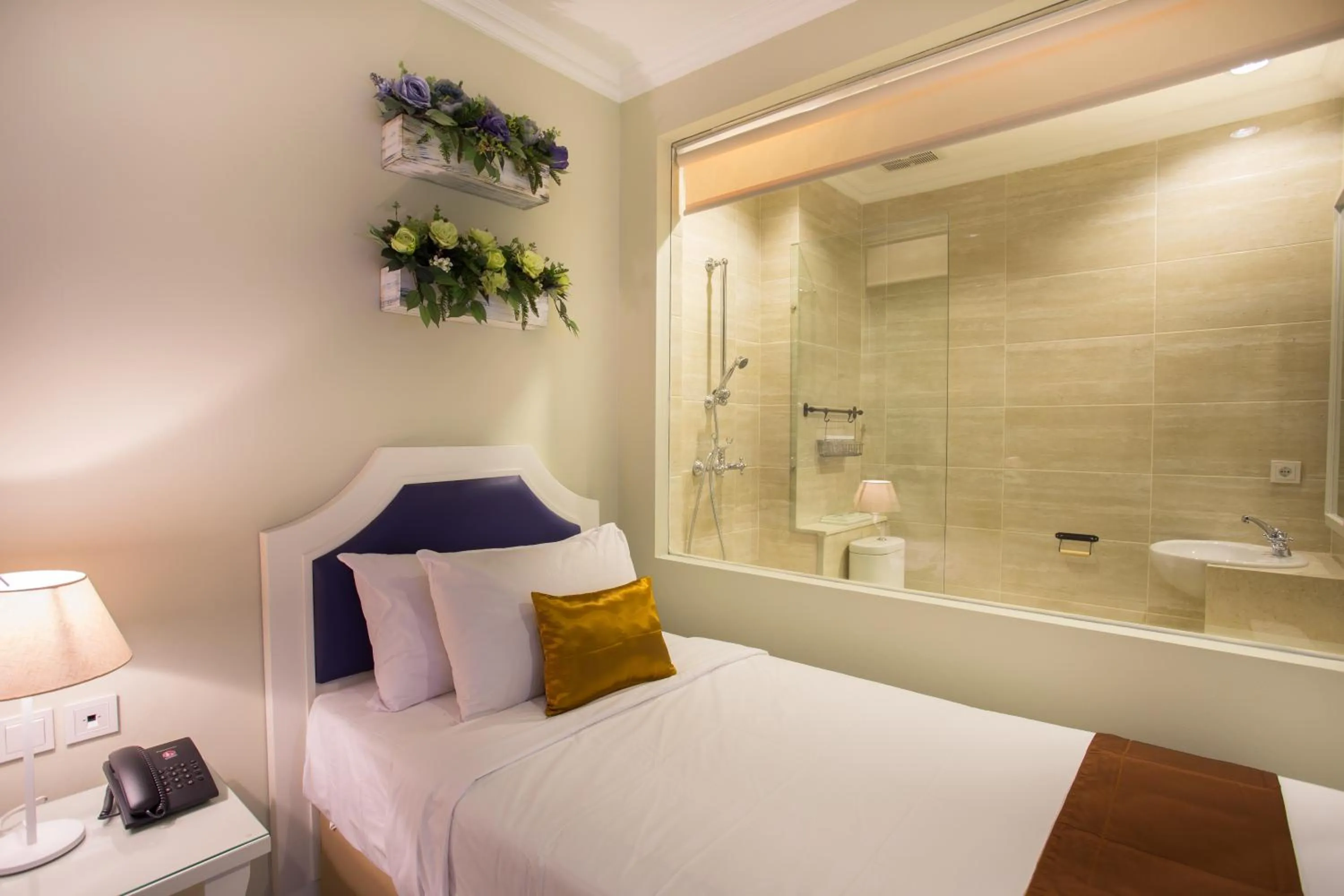 Bed in Amalfi Hotel Seminyak