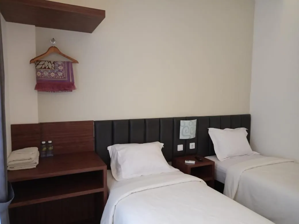 Bed in Alzara Hotel Syariah