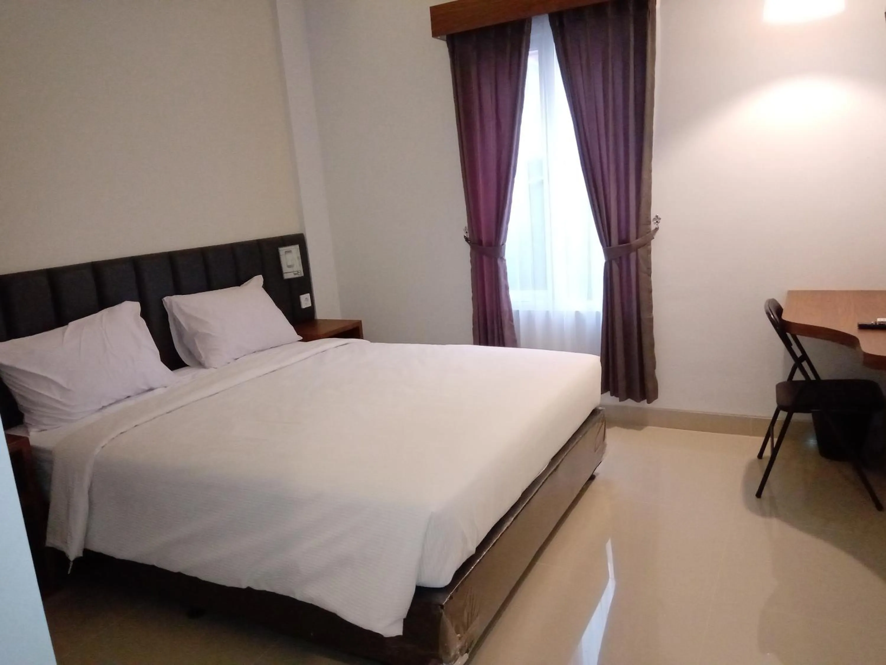 Bed in Alzara Hotel Syariah
