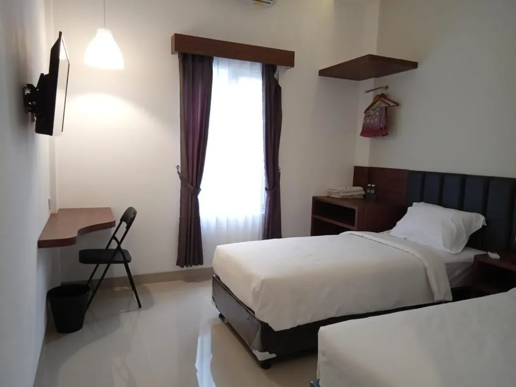 Bed in Alzara Hotel Syariah