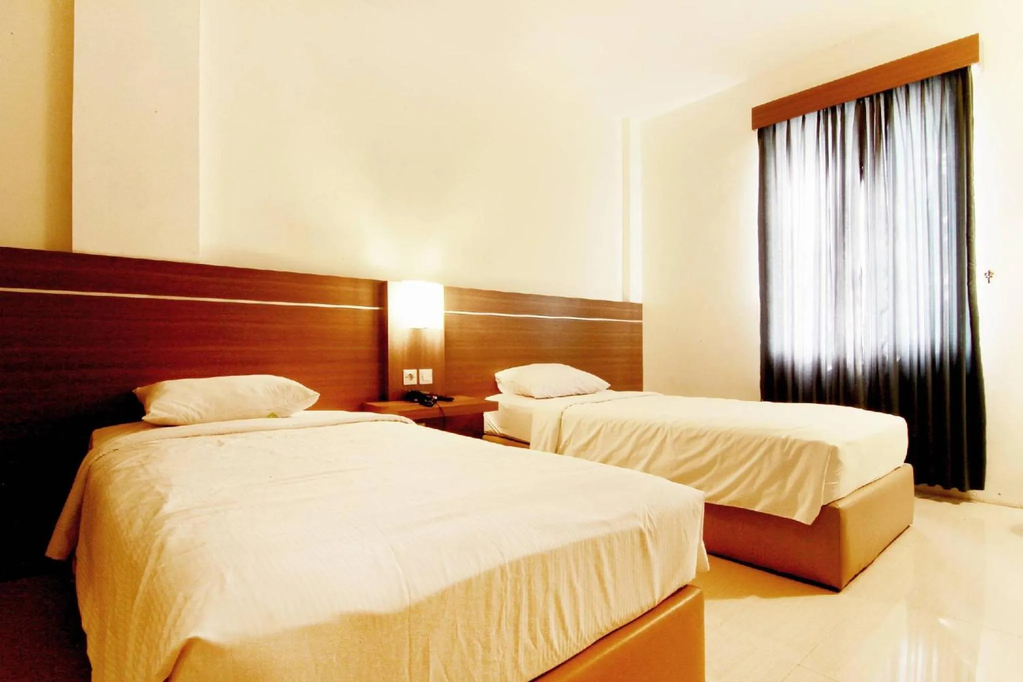 Bed in Alzara Hotel Syariah