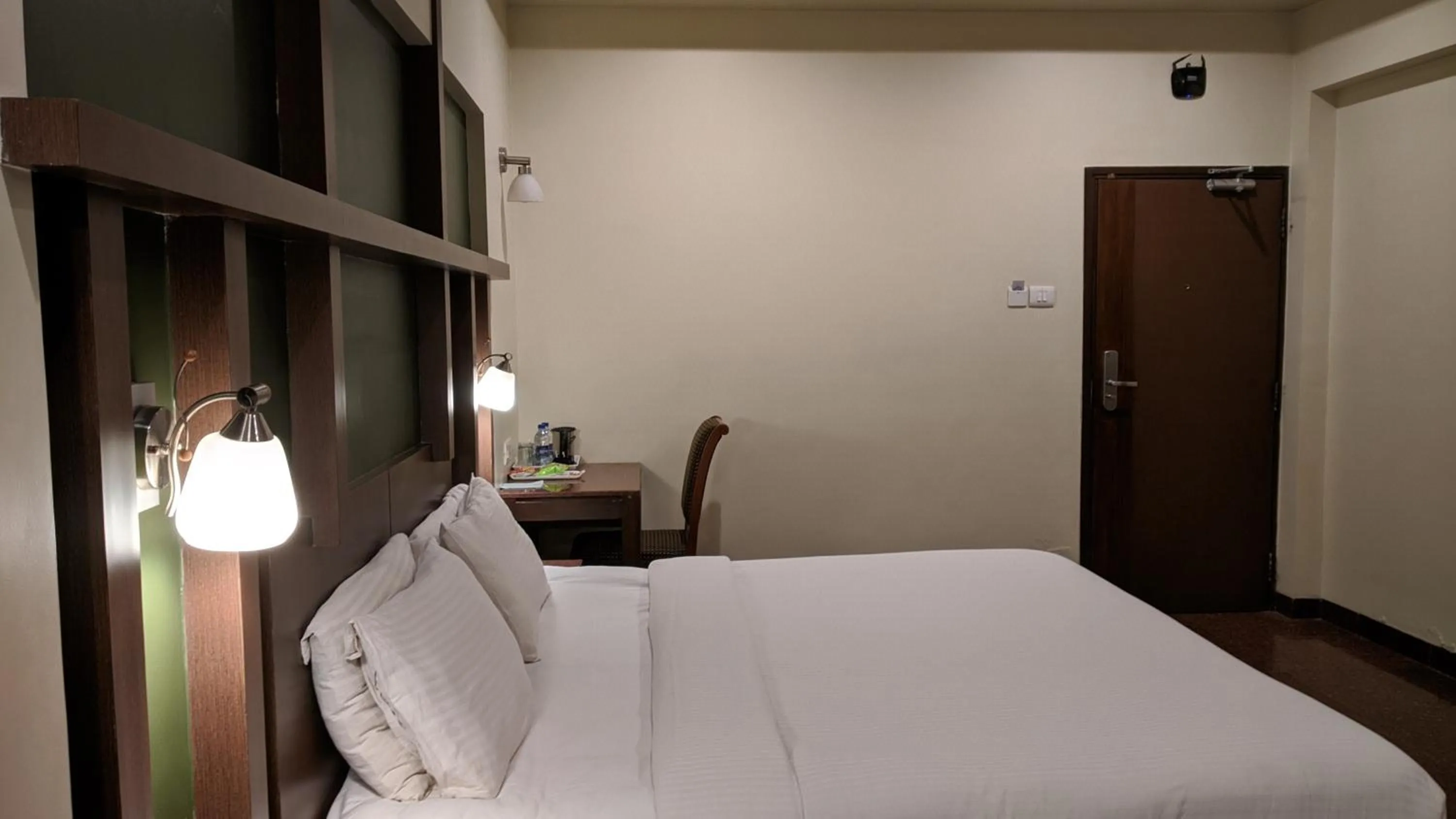 Bed in Hotel Sankam Residency
