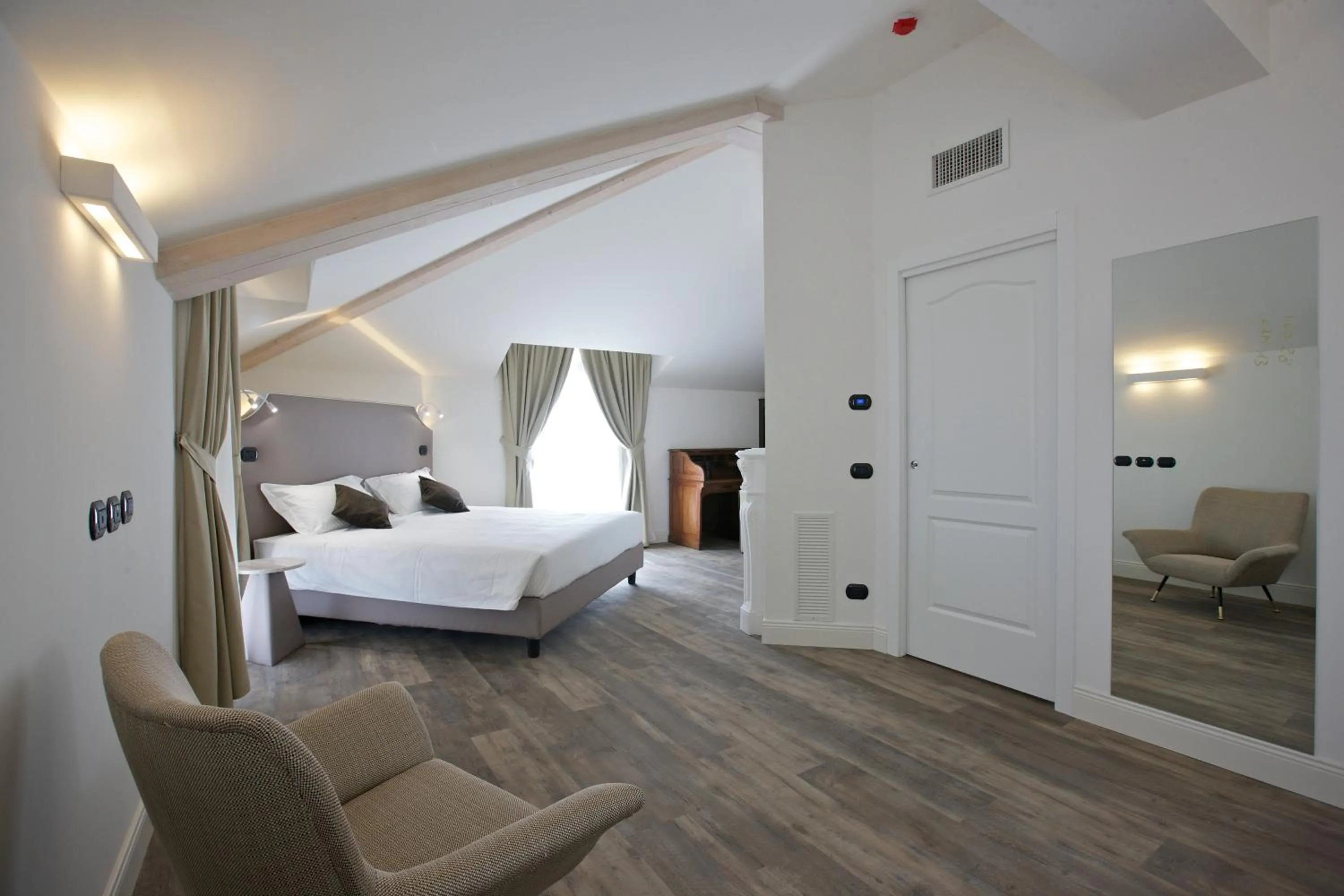 Bed in Hotel Al Campanile - Luxury Suites & Apartments