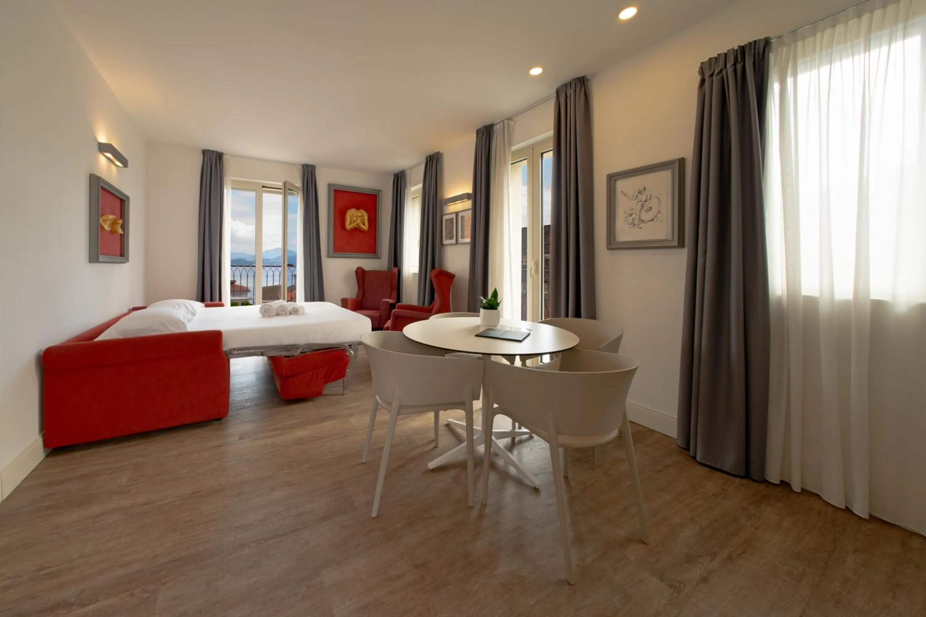 Living room, Bed in Hotel Al Campanile - Luxury Suites & Apartments