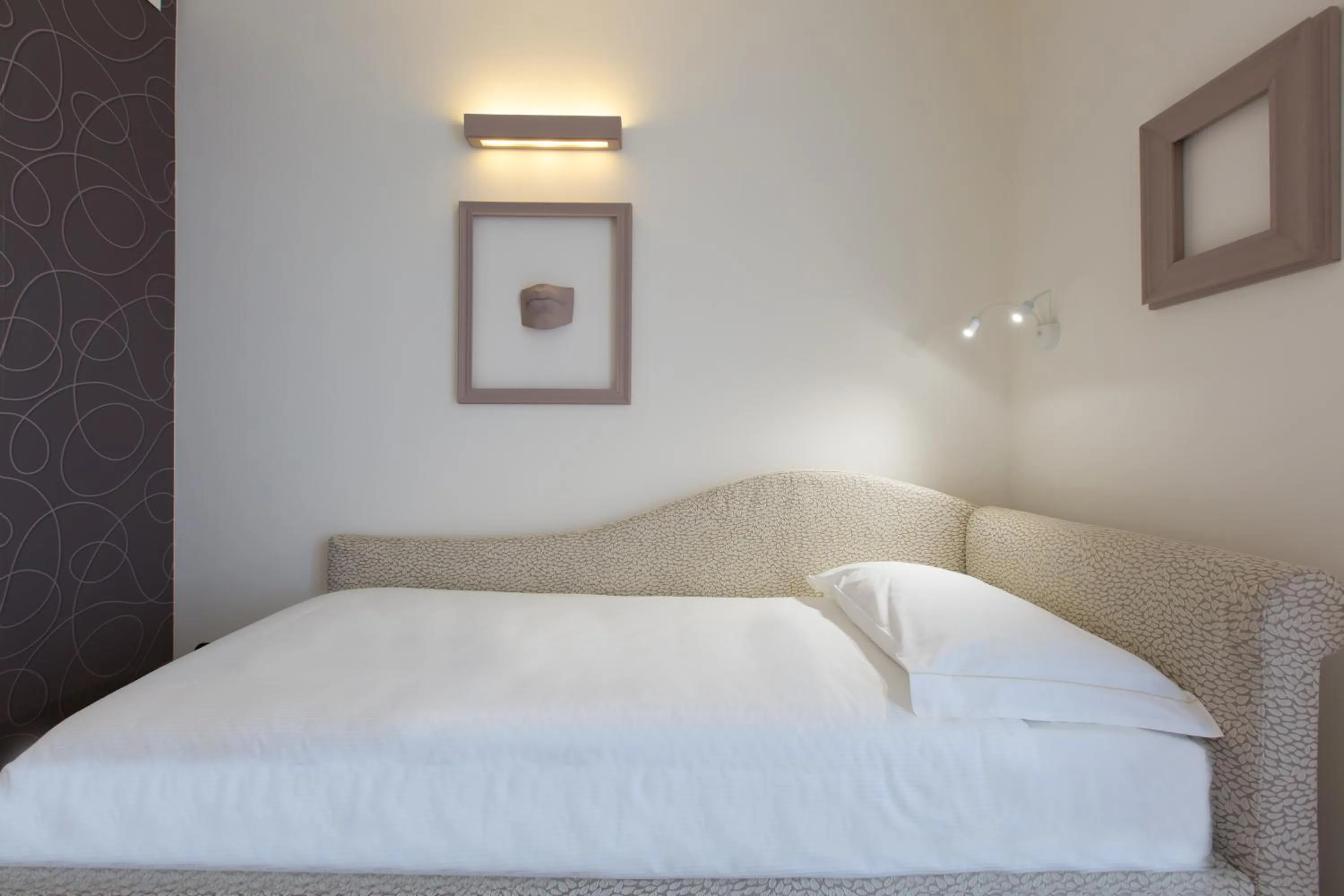 Bed in Hotel Al Campanile - Luxury Suites & Apartments