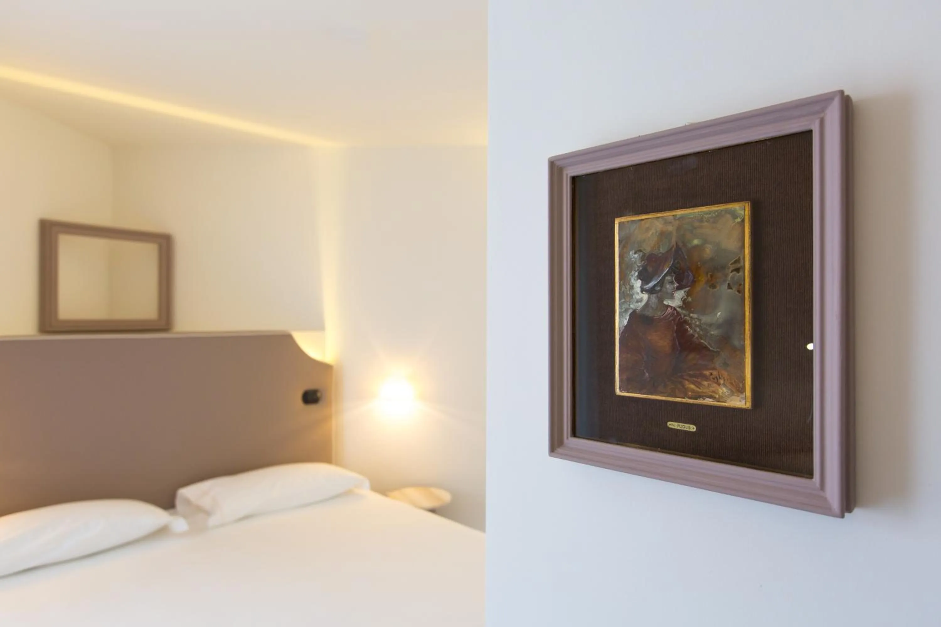 Decorative detail, Bed in Hotel Al Campanile - Luxury Suites & Apartments