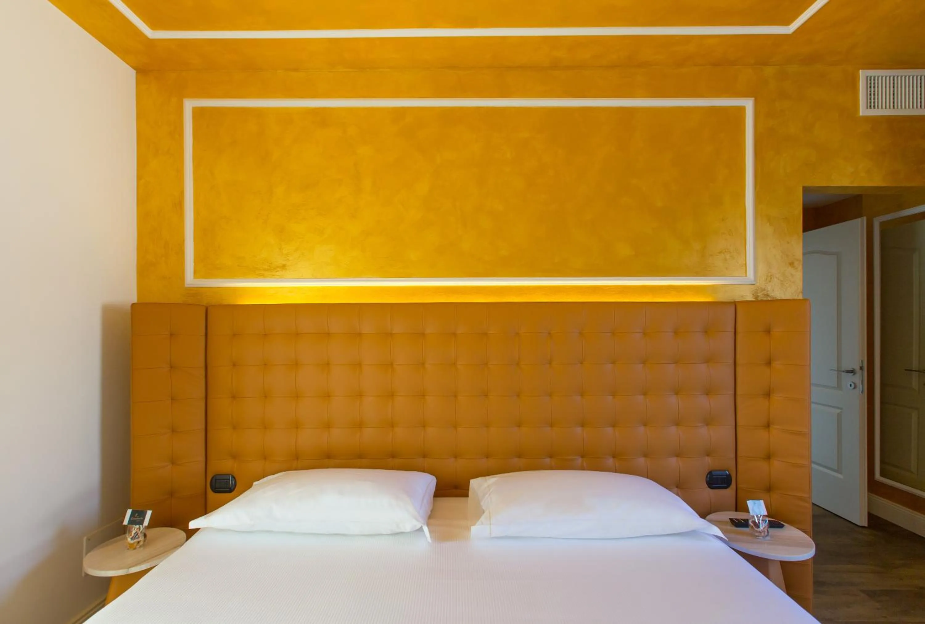 Bed in Hotel Al Campanile - Luxury Suites & Apartments