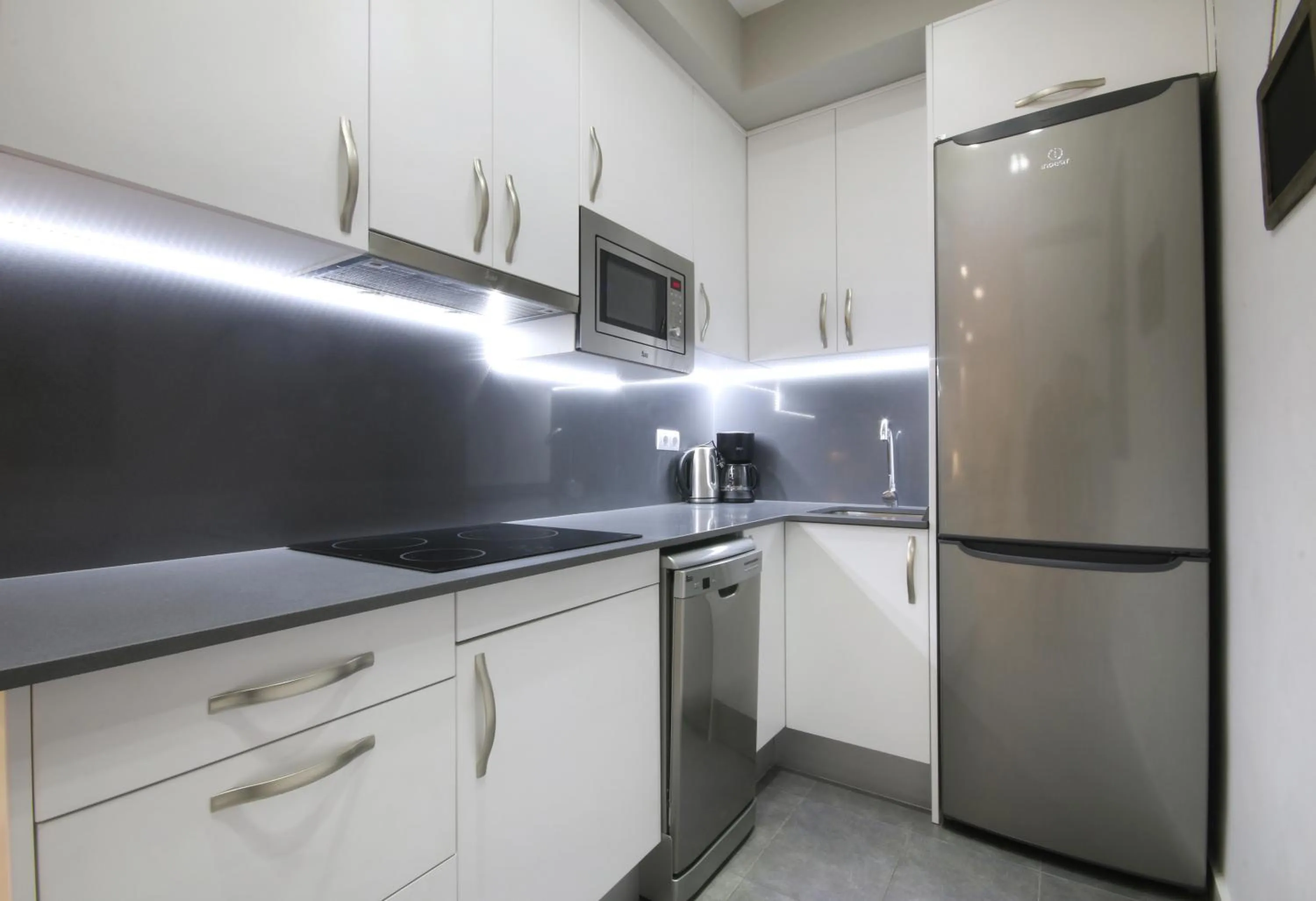 Kitchen or kitchenette in Suite Place Barcelona Còrsega