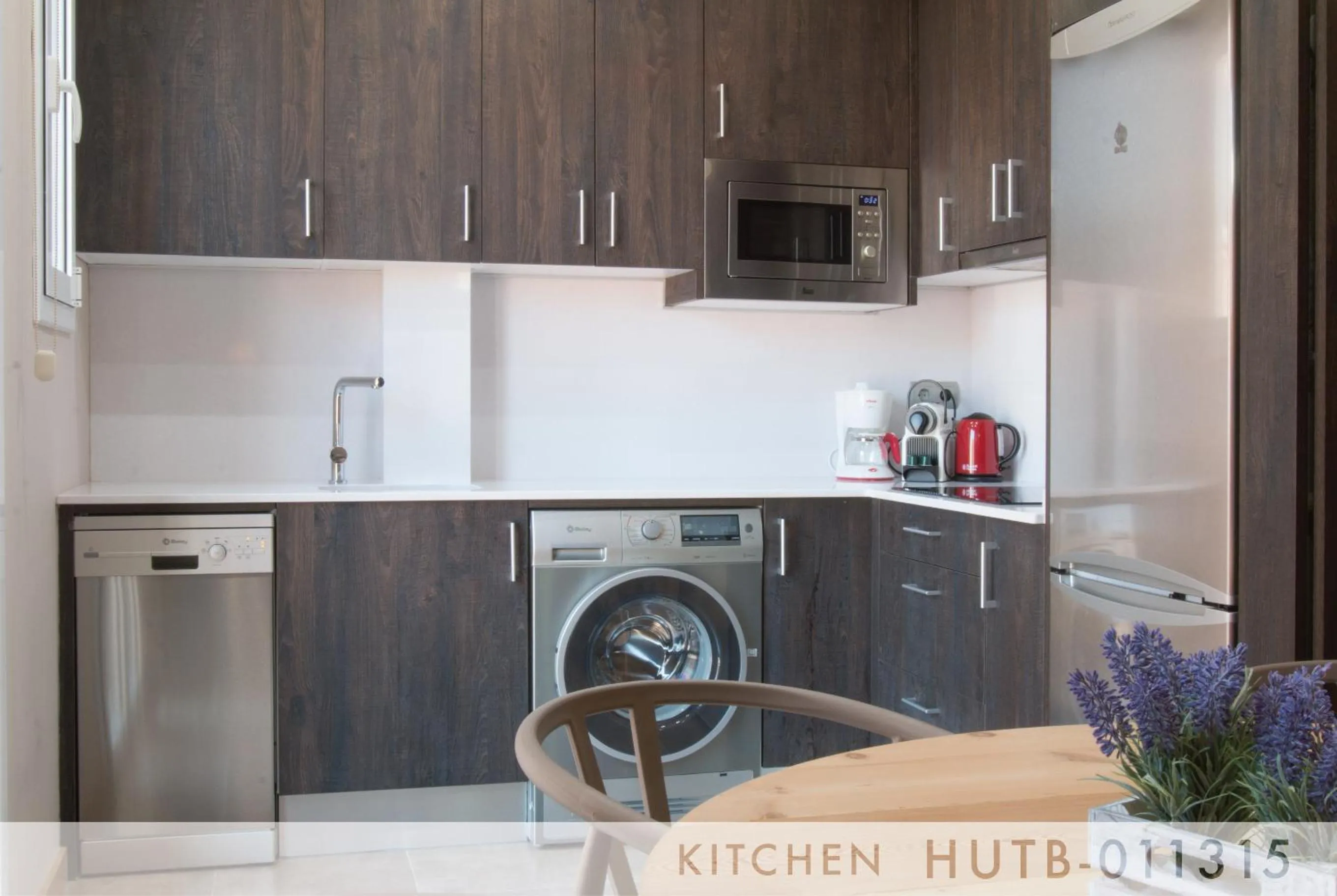 Kitchen or kitchenette in Suite Place Barcelona Còrsega