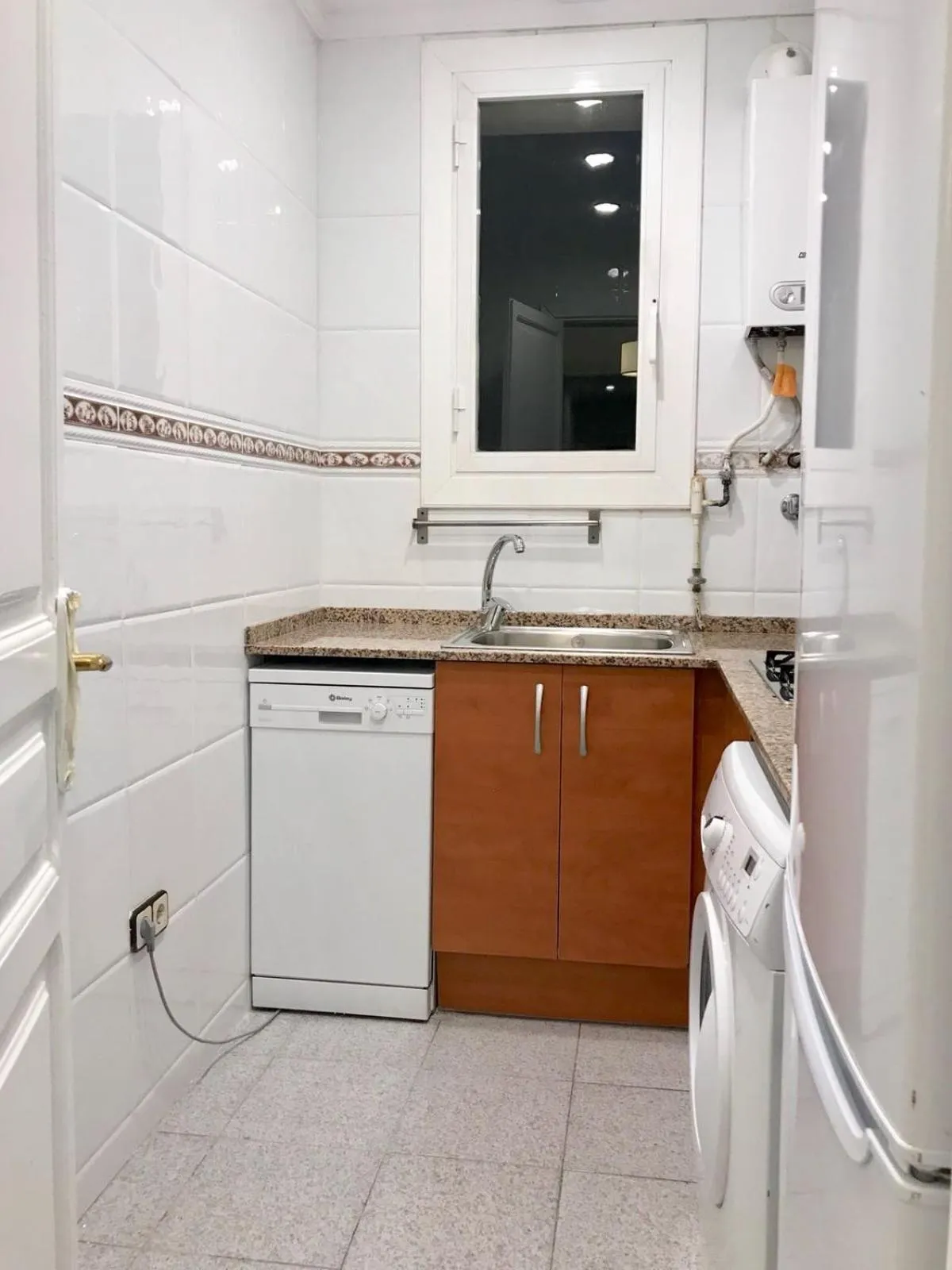 Kitchen or kitchenette in Suite Place Barcelona Còrsega