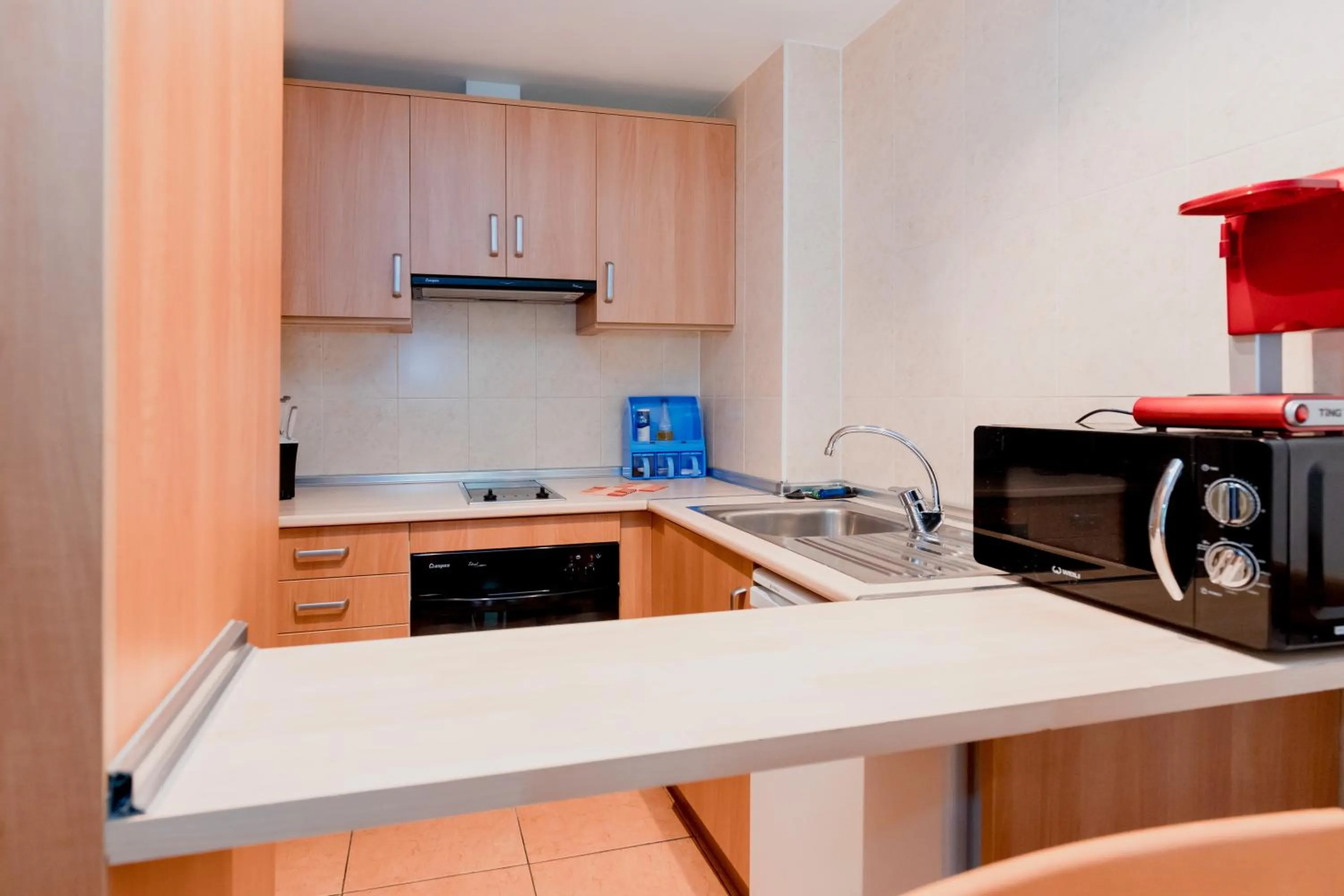 Kitchen or kitchenette in Pierre & Vacances Aparthotel La Tulipa