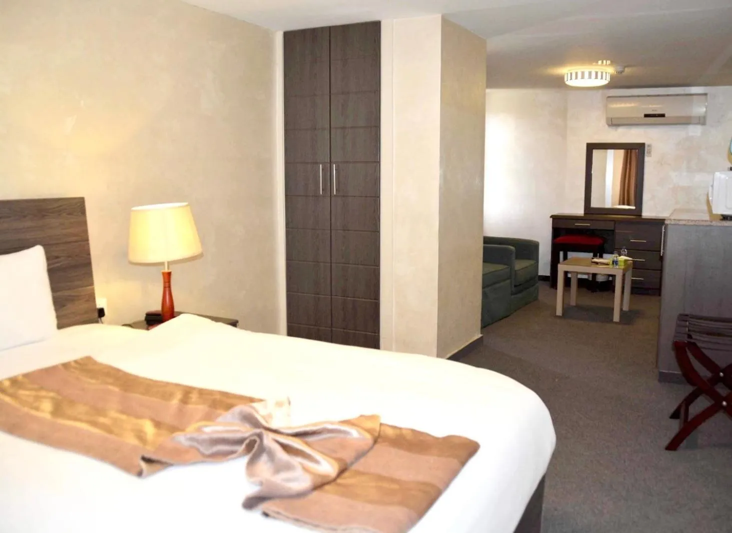 Bed in Olive Hotel Amman