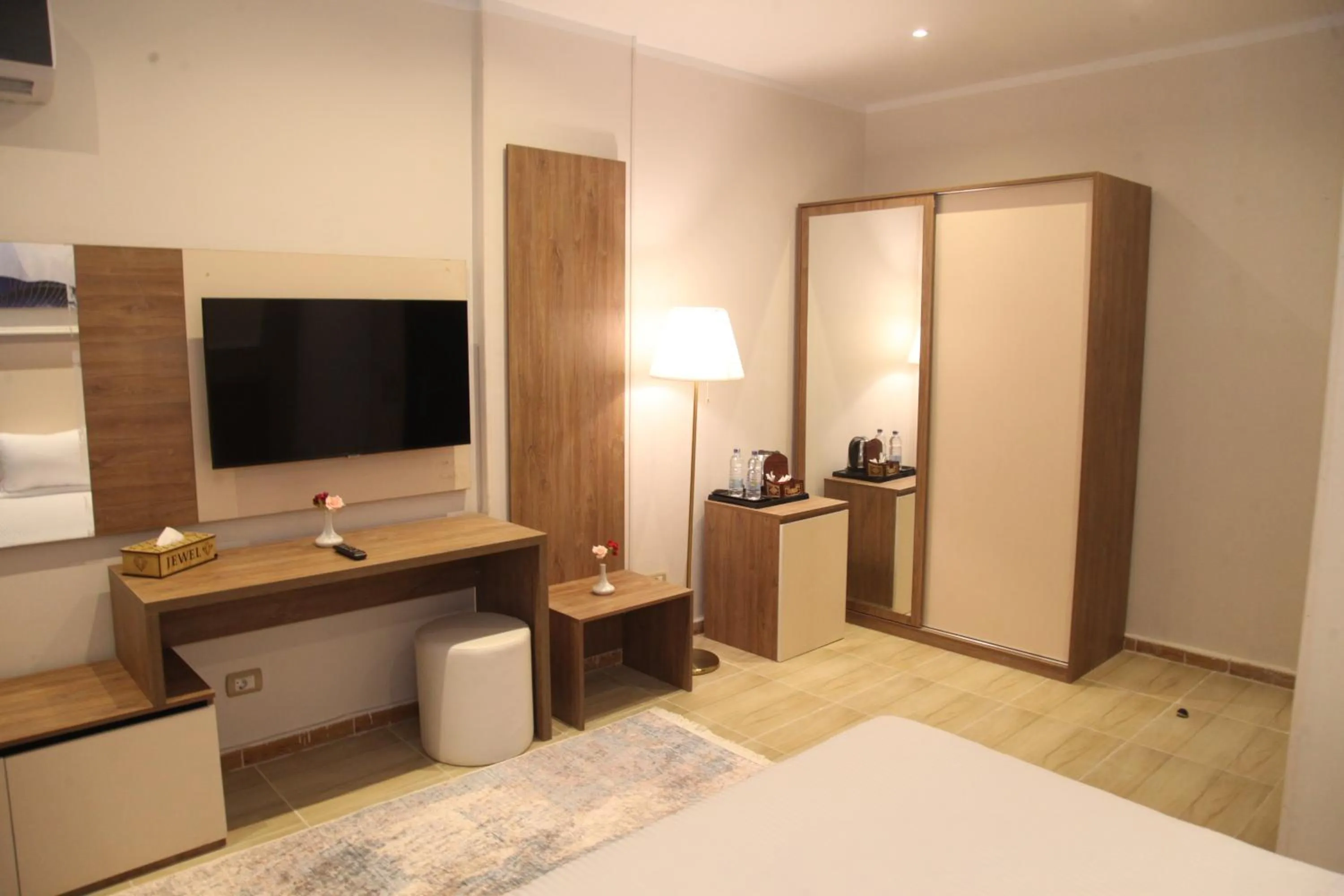 Communal lounge/ TV room, Bed in Jewel Assiut Hotel