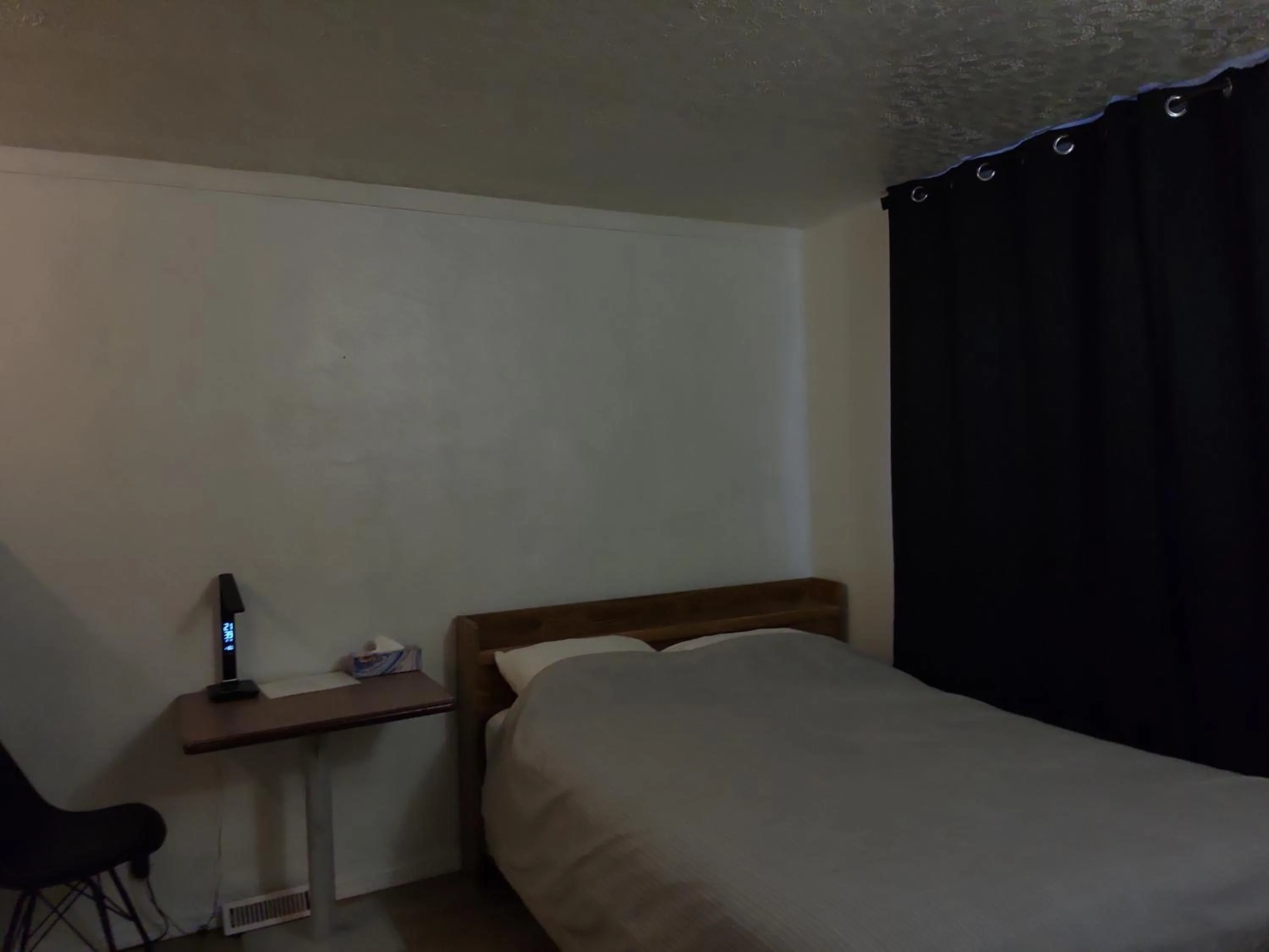 Bed in Centennial Motel