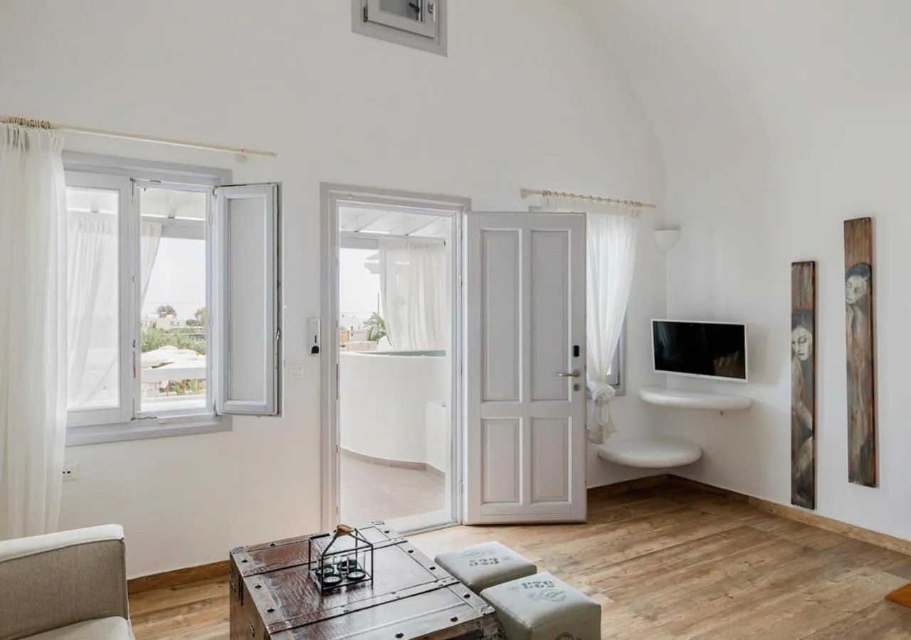Seating area, Bed in Orabel Suites Santorini (Adults Only)