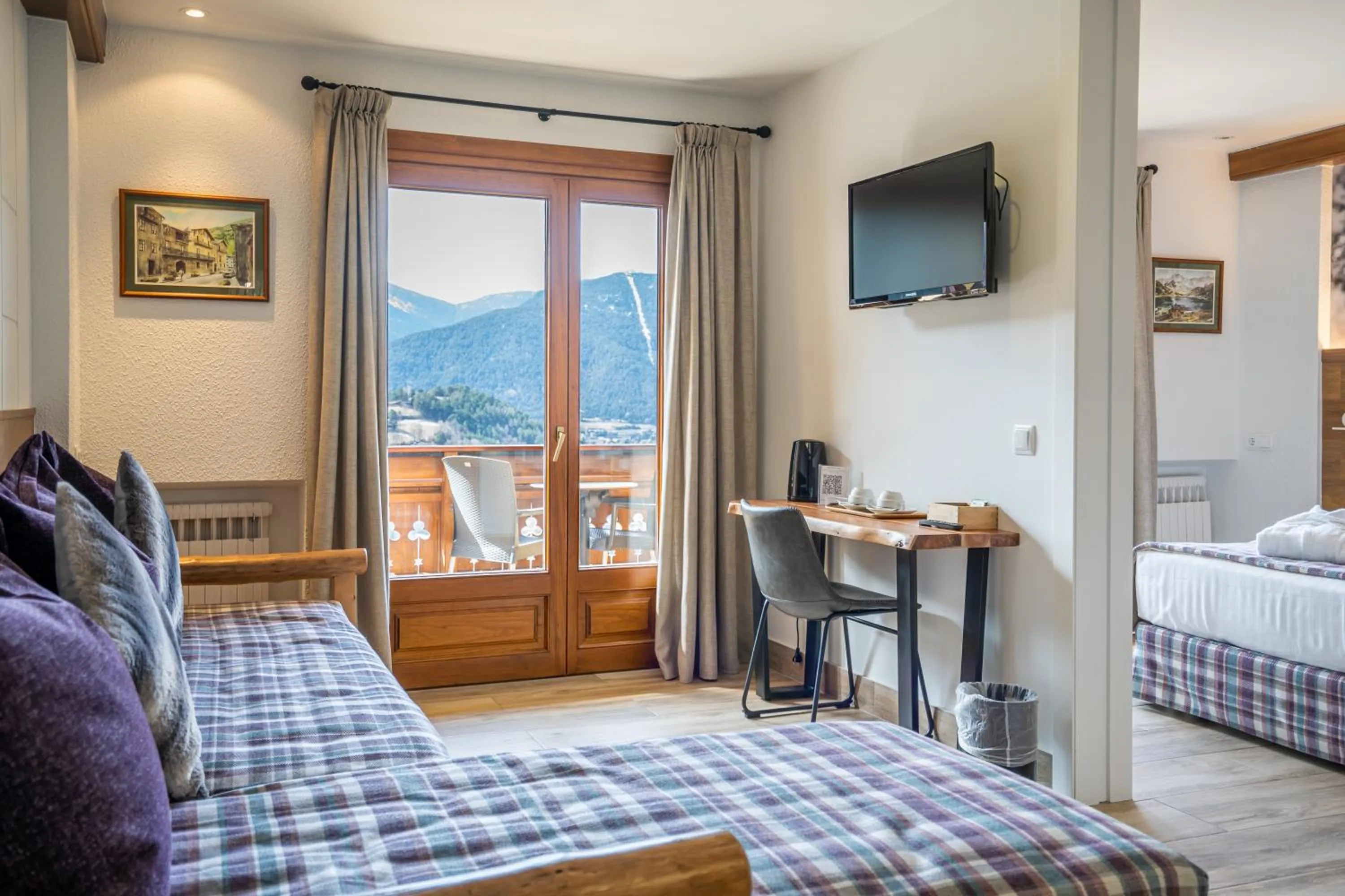 Communal lounge/ TV room, Bed in Abba Ordino Babot Hotel