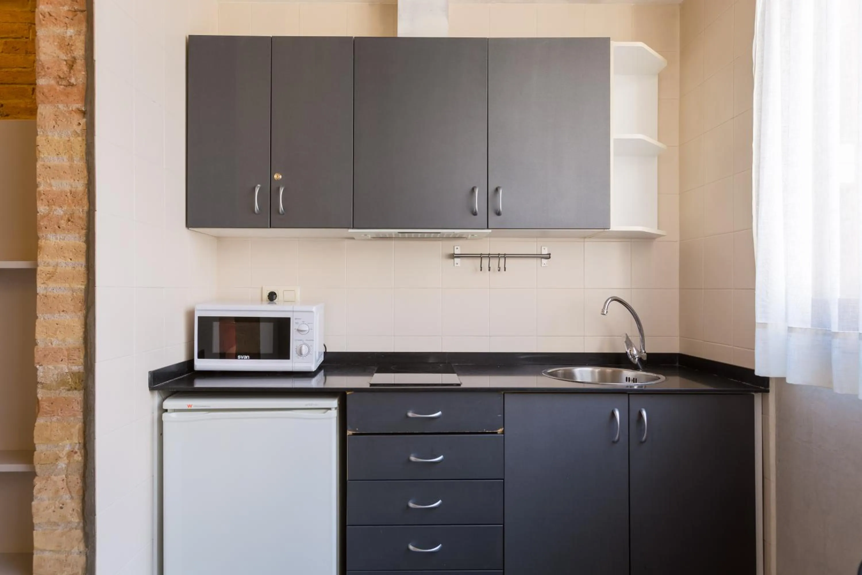 Kitchen or kitchenette in Apartamentos DV