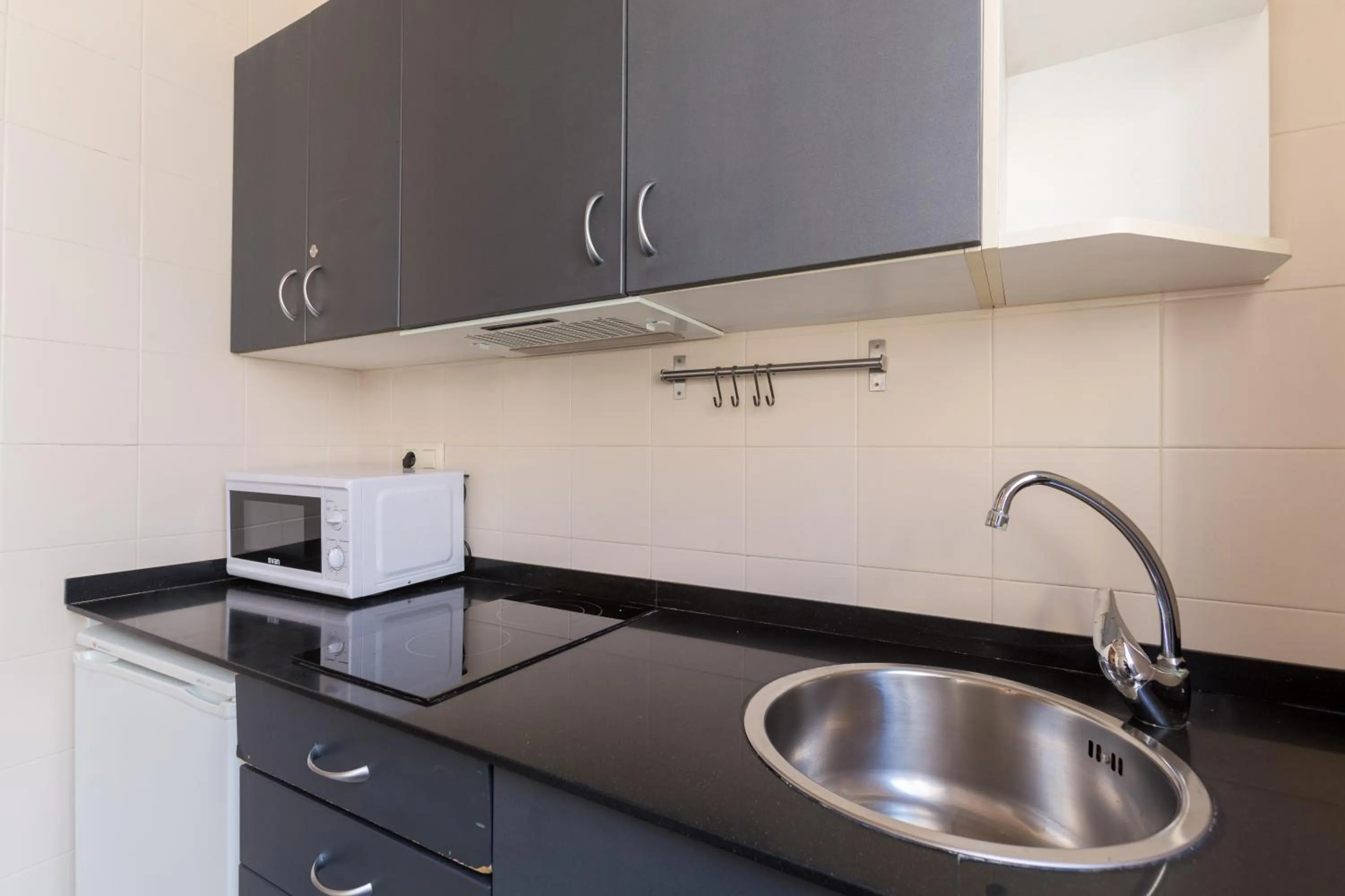 Kitchen or kitchenette in Apartamentos DV