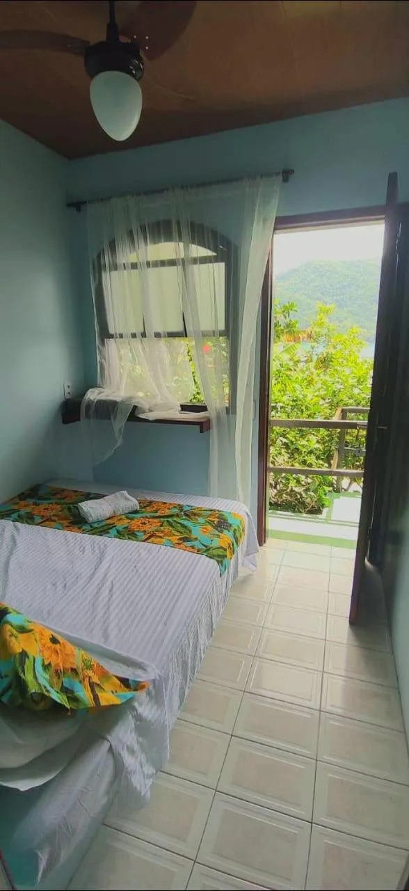 Bed in Pousada Toca do Mar