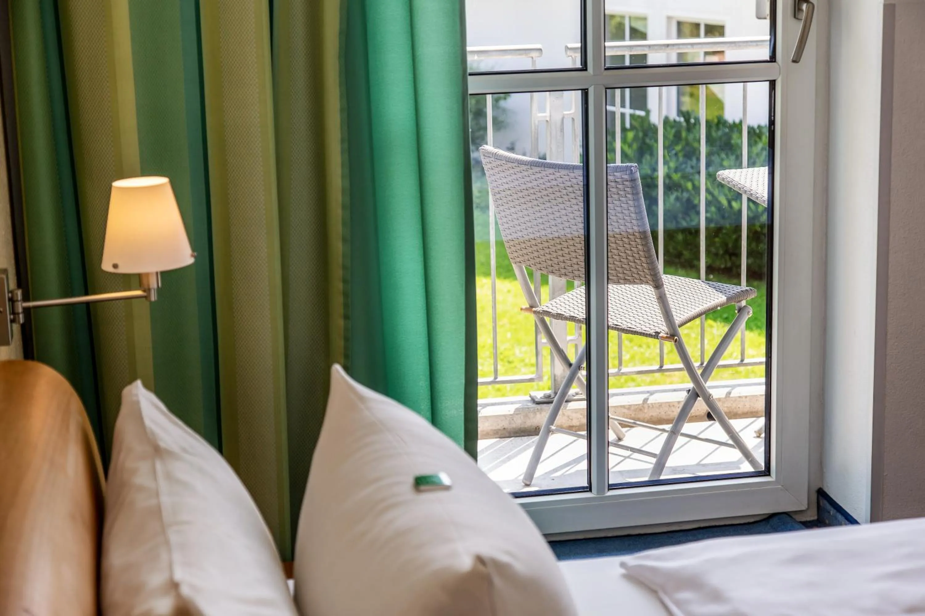 Garden view, Bed in Arcus Hotel München Messe