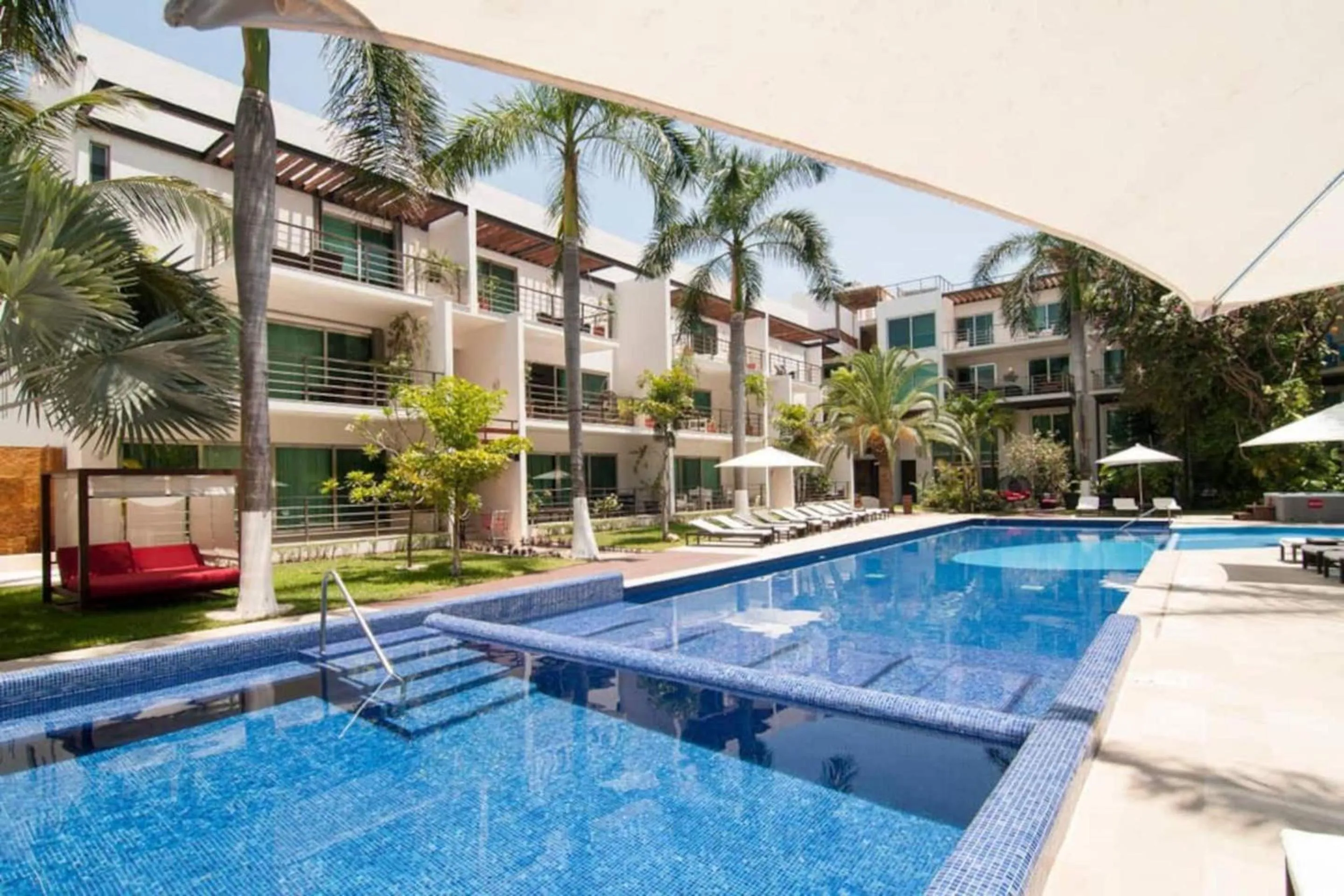 Pool view in Luxurious & Central Condo In Playa Steps From The Beach
